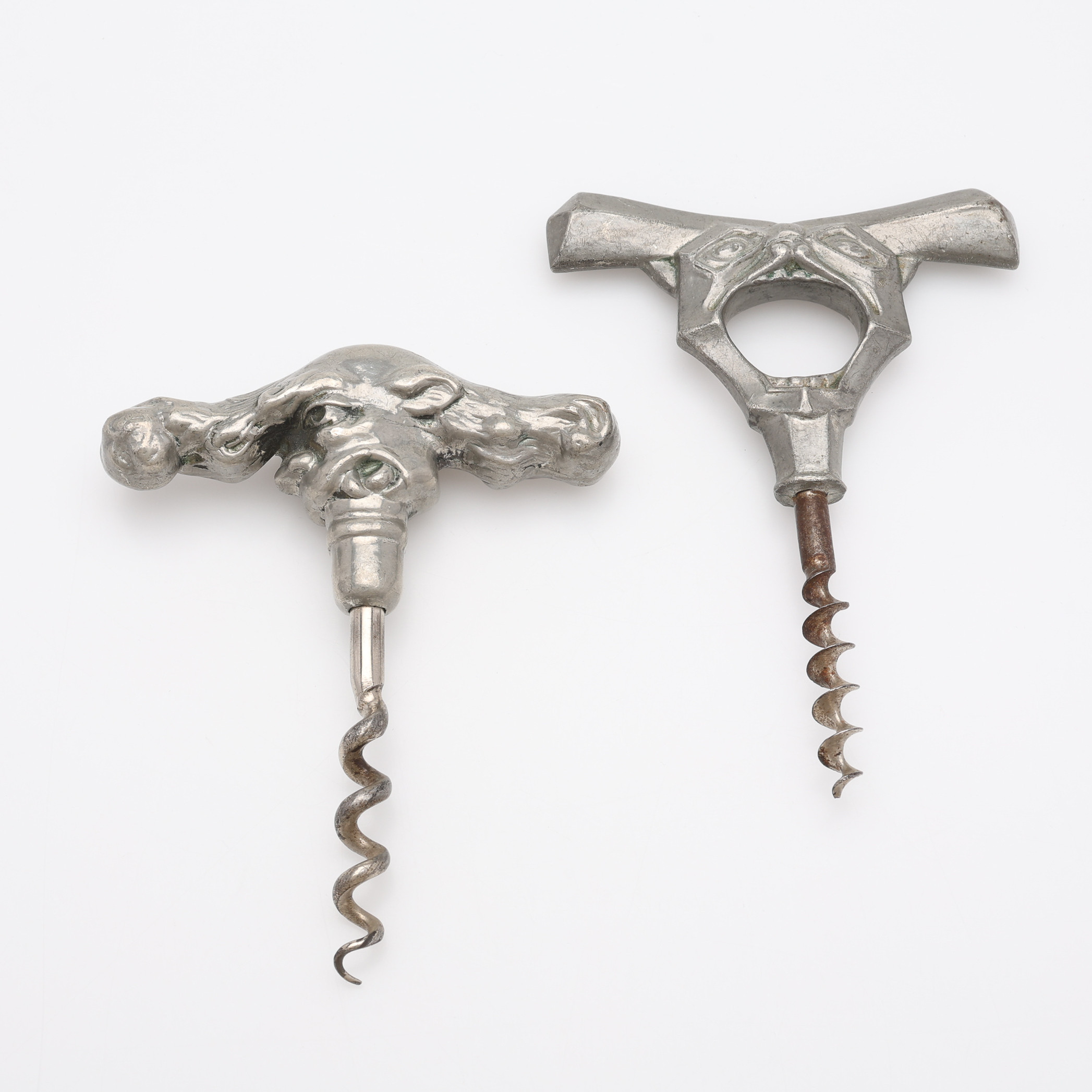 TVÅ STYCKEN INTRESSANTA KORKSKRUVAR, sannolikt Danmark, tenn och stål, 1900-talets början.