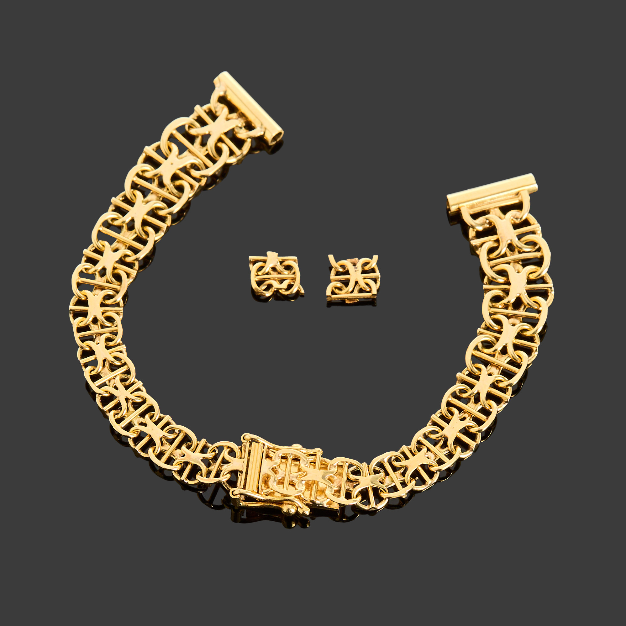 KLOCKARMBAND SAMT TVÅ LÄNKDELAR, 18k guld, X-länk med stav, Clareus Firma Tore, Enebyberg, 1979.