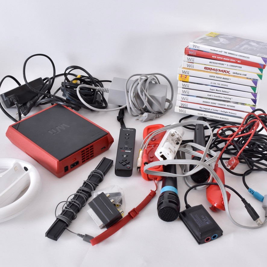 NINTENDO WII parti med konsoler/tillbehör och 11 spel.