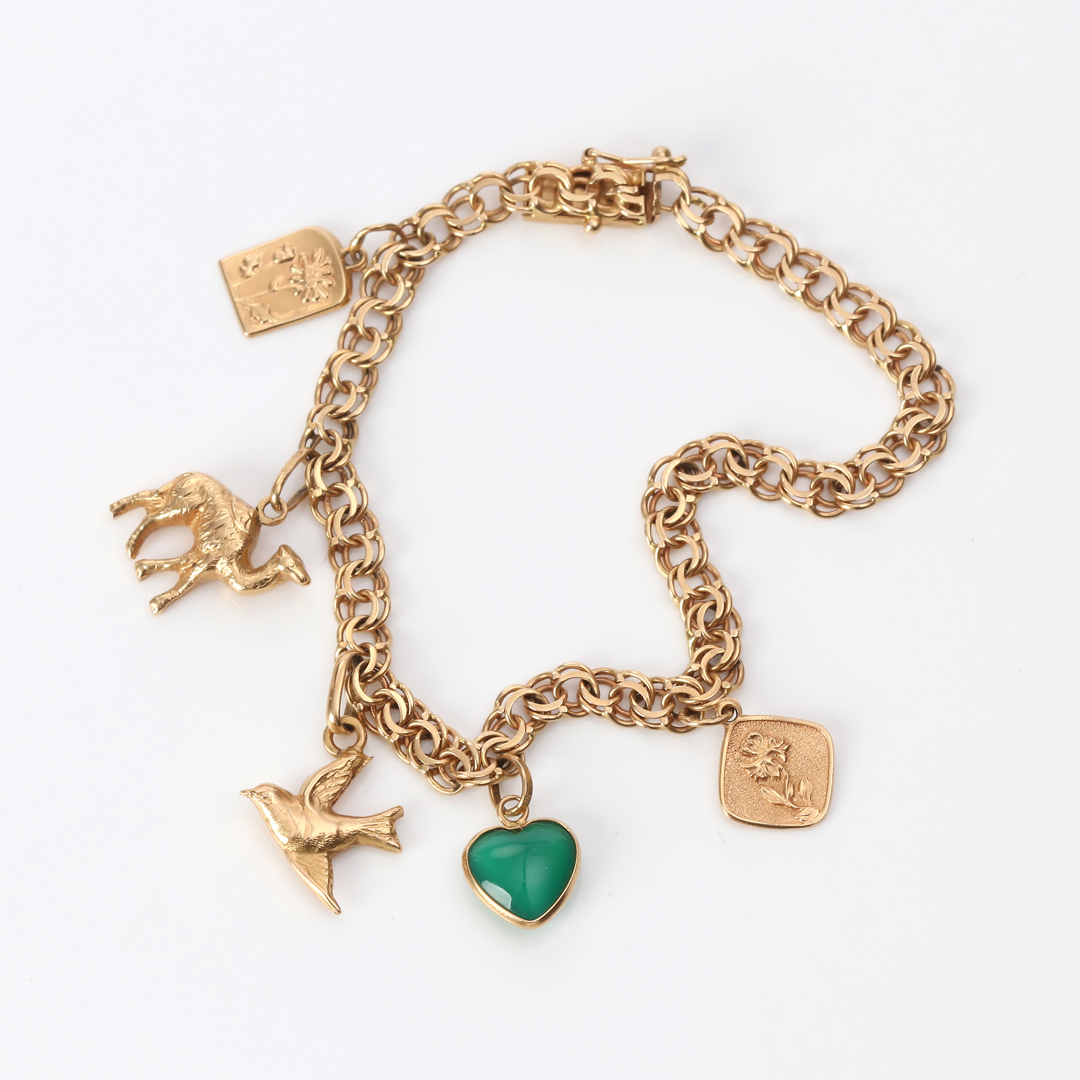 BERLOCKARMBAND. 18k guld med en grön sten, totalvikt ca 10,1 gram.