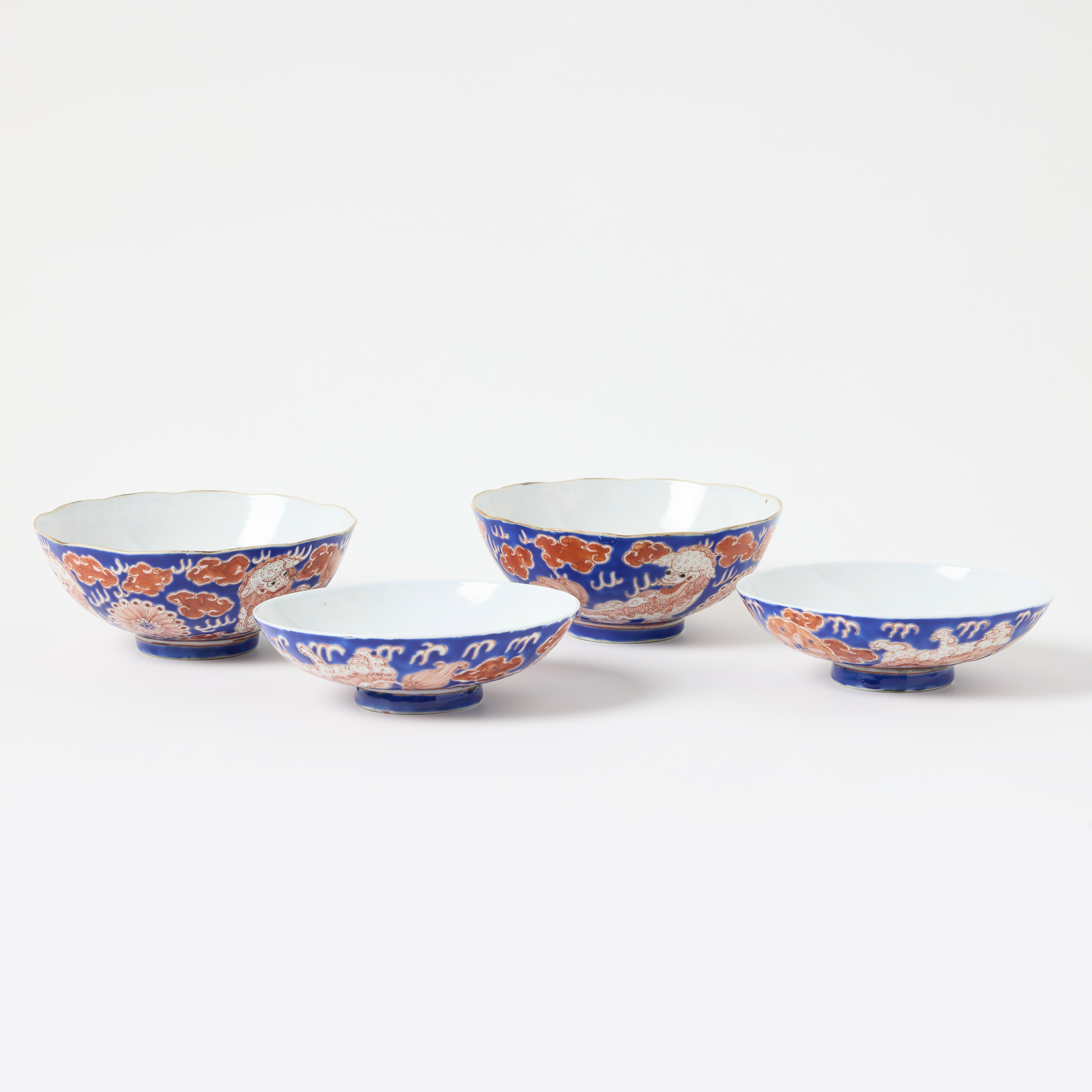 A Pair of Chinese Iron Red and Blue Bowls and Covers.