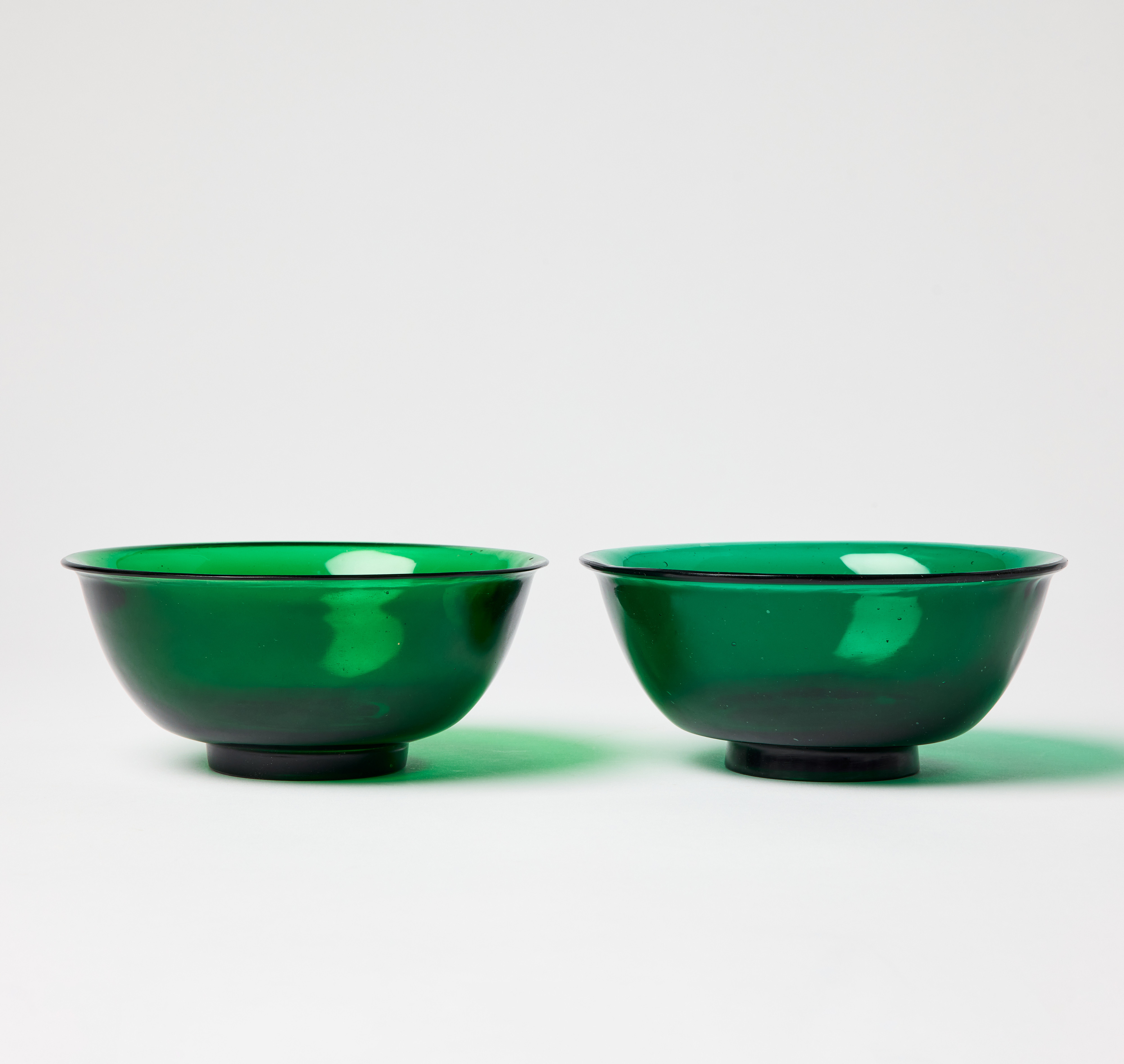 A Pair of Chinese Green Translucent Glass Bowls.