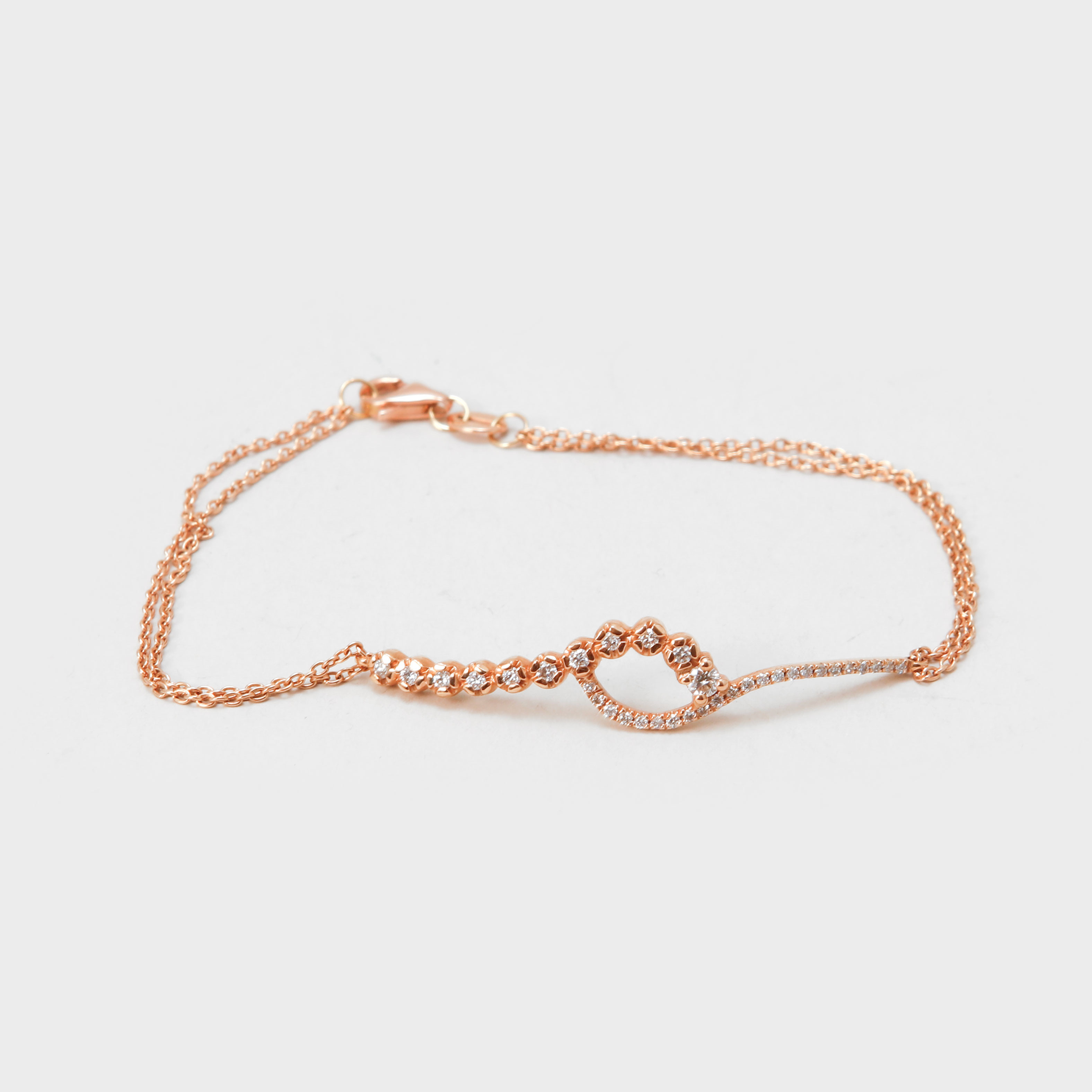 ARMBAND, 14k roséguld, diamanter, vikt ca 3 gram.