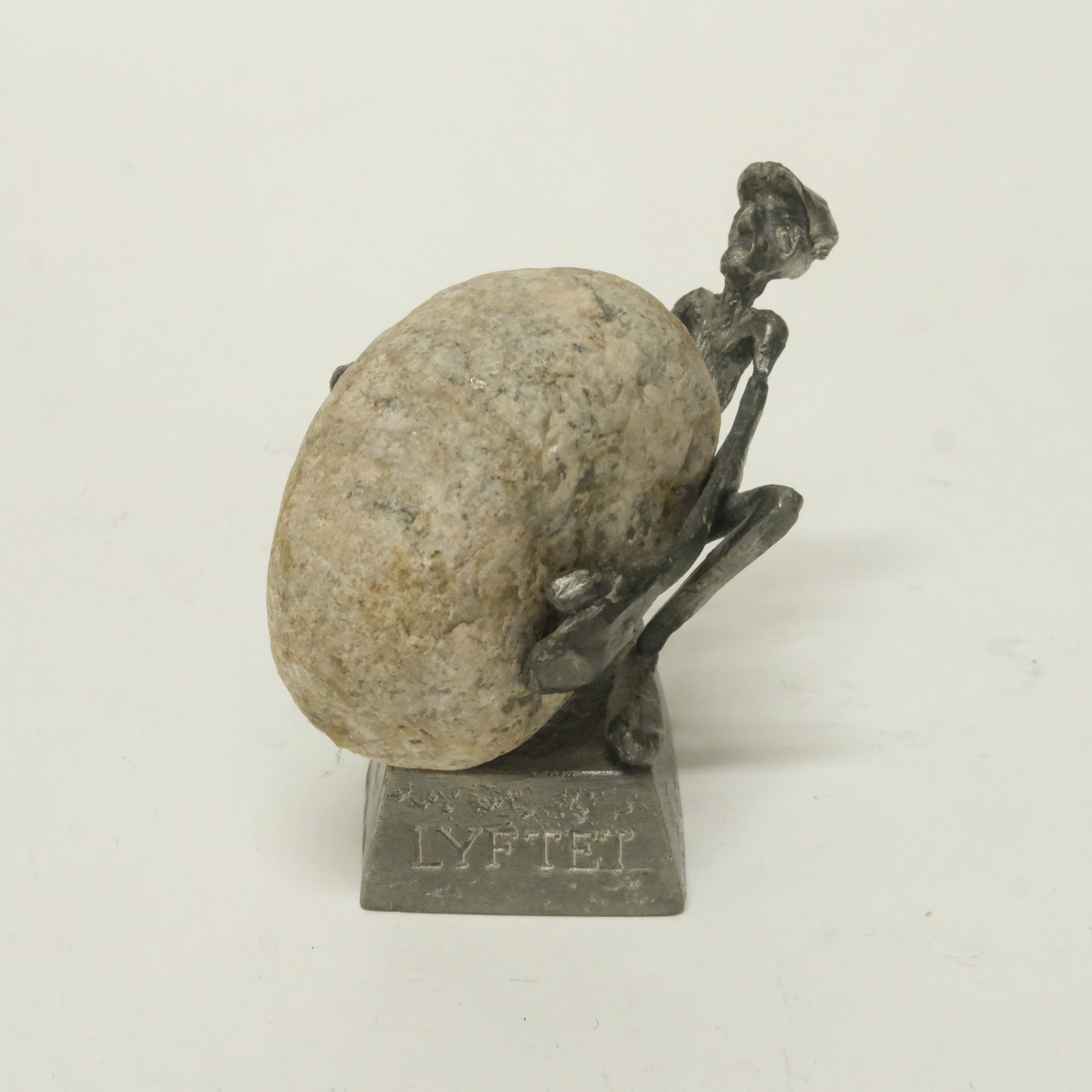 HENRY GUSTAVSSON. SKULPTUR I TENN OCH STEN " LYFTET ".