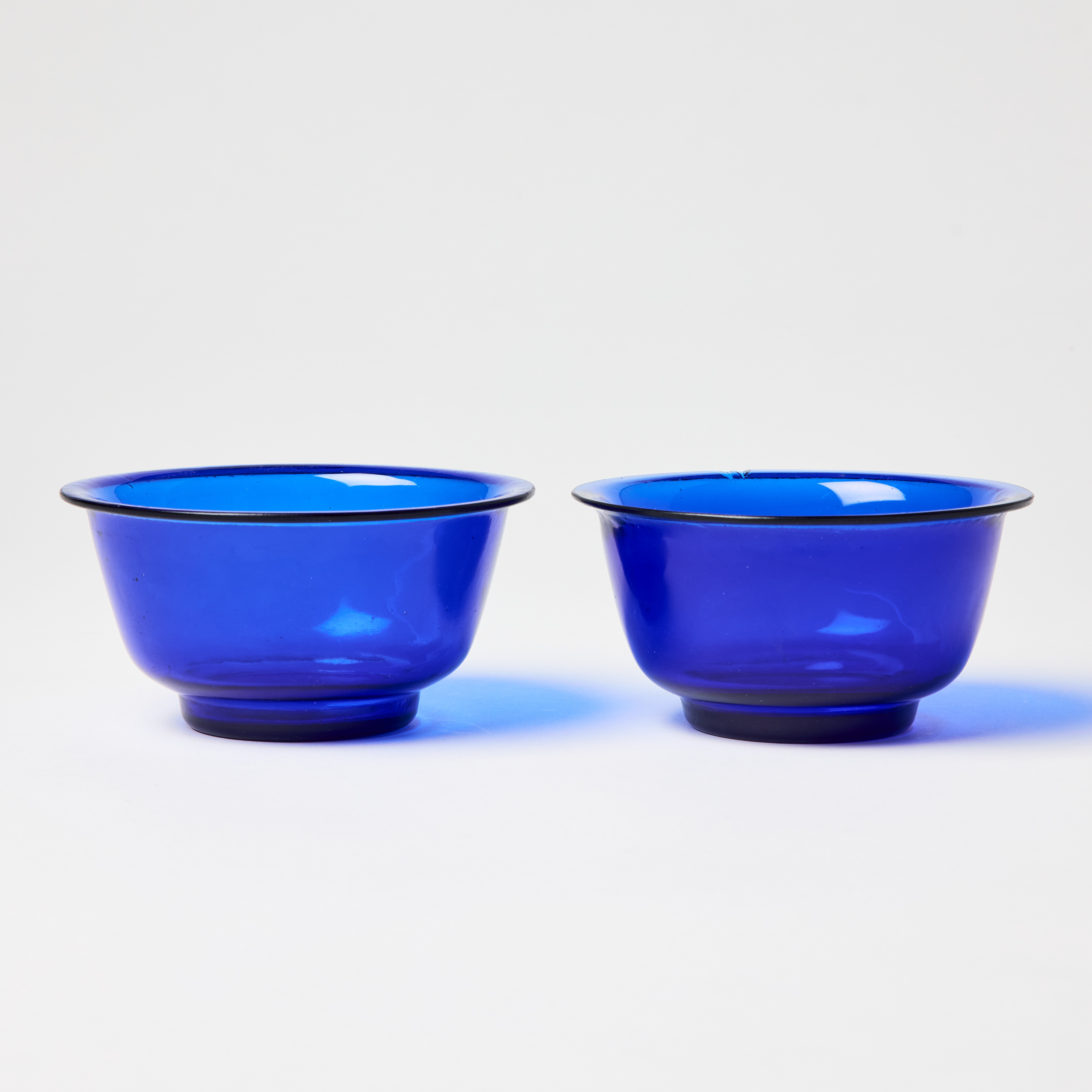 A Pair of Chinese Blue Translucent Glass Bowls.