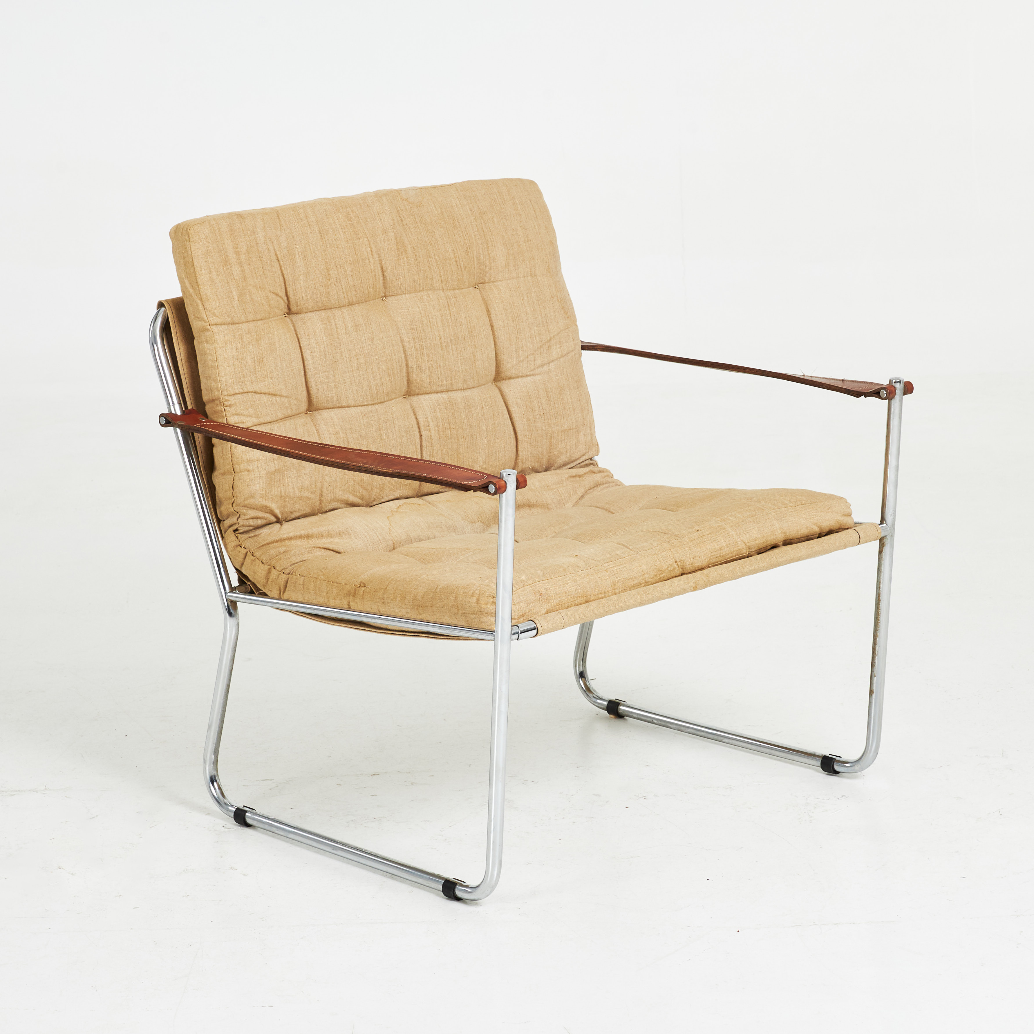 FÅTÖLJ. 1970-tal, kromad stomme, läder, canvas, plymås canvas djuphäftad.