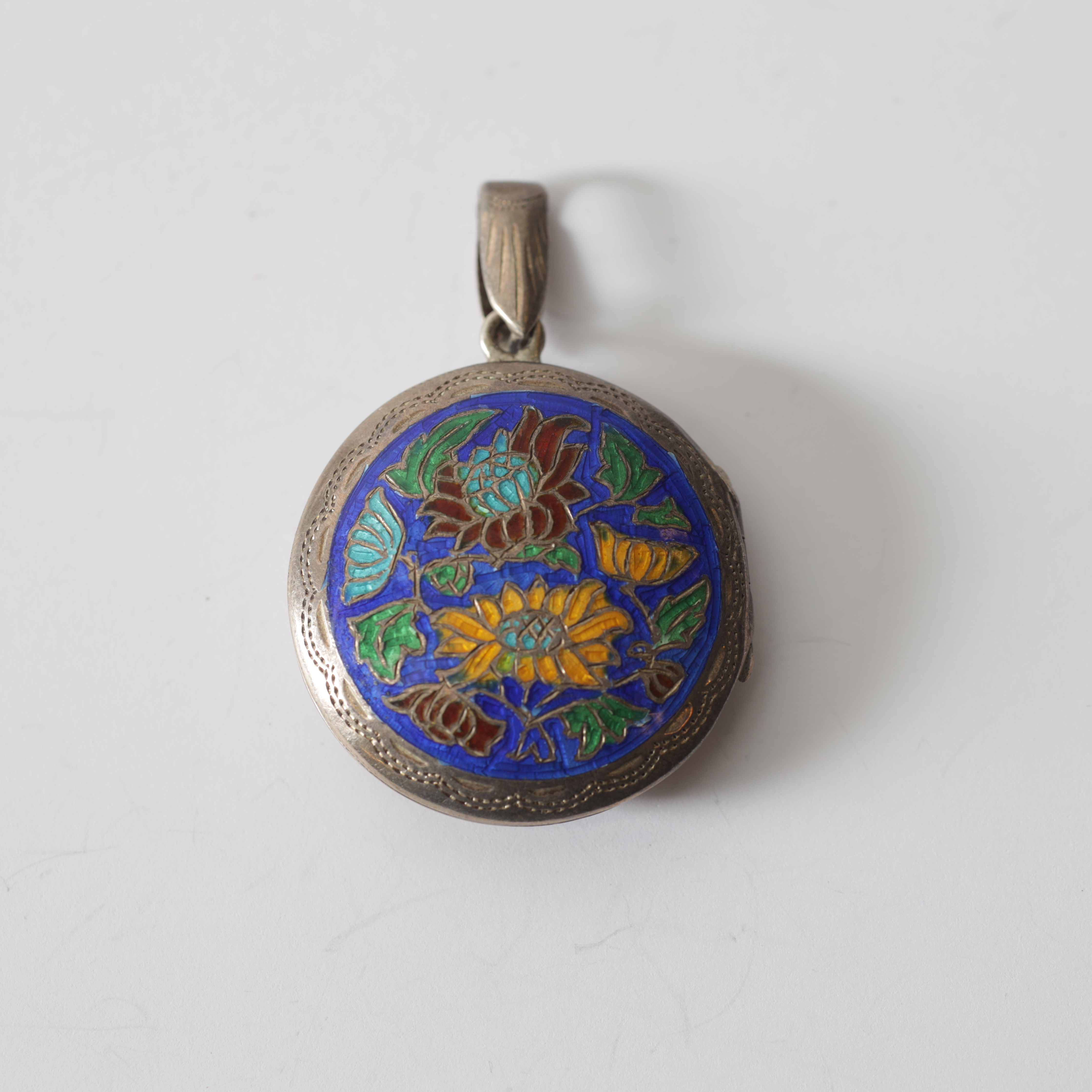 FOTOGÖMMA, sterlingsilver & emalj. Totalvikt ca 11,5 gram.