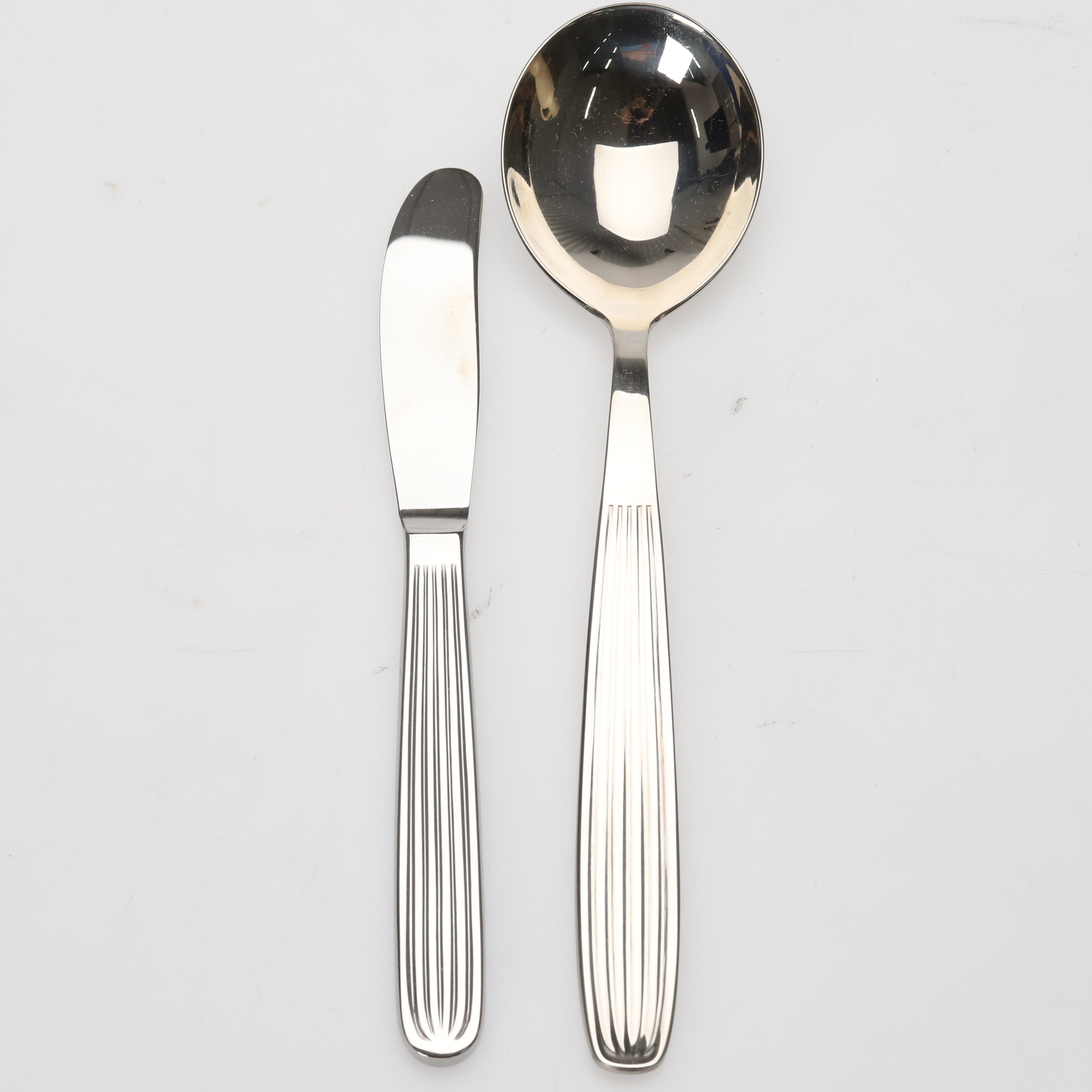 KAJ FRANCK, ostknivar och skedar "Ideal", rostfritt stål, 12 st.