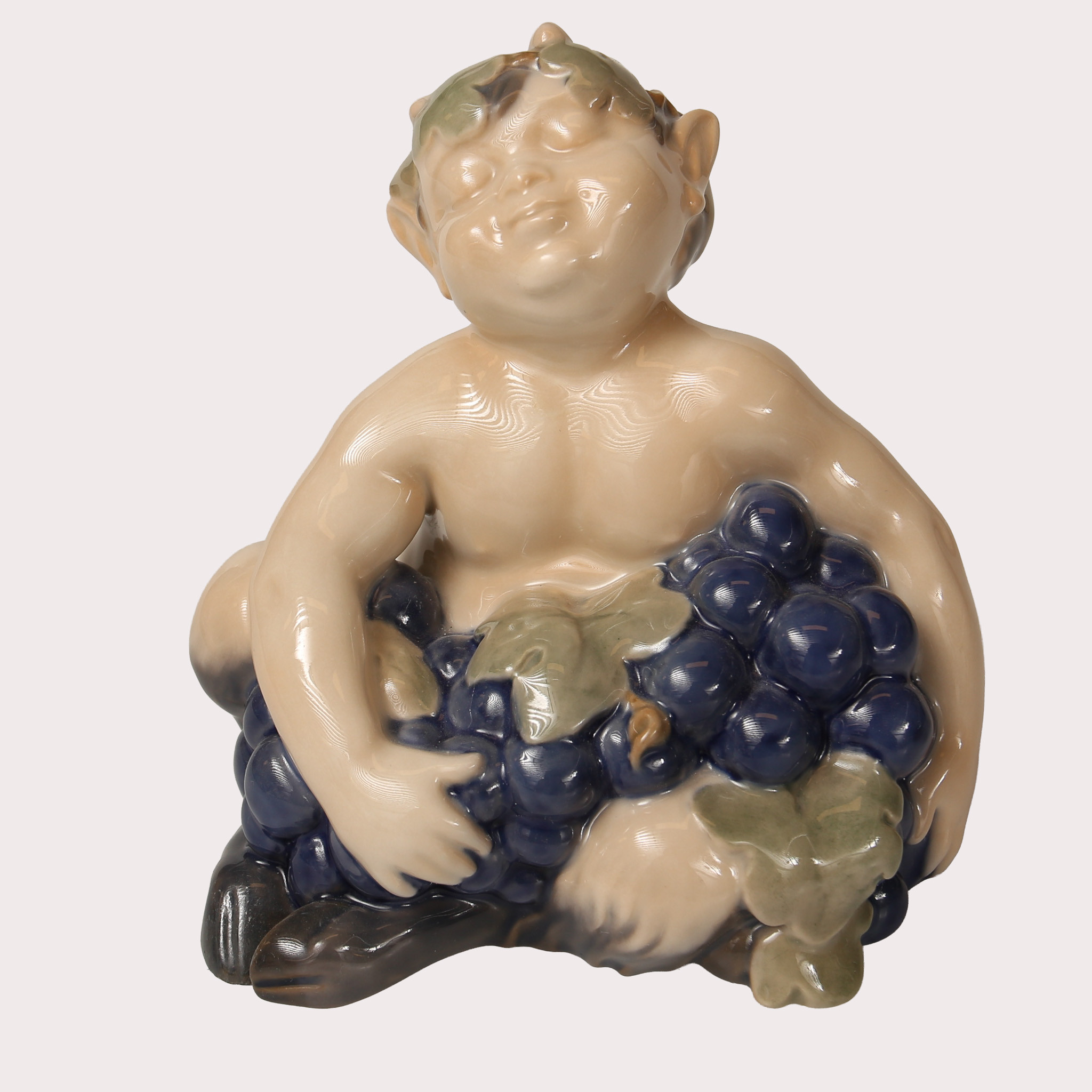 FIGURIN, porslin, "Faun", (satyr, Pan), modell nr 2361, formgiven av Vilhelm Waldorff, Royal Copenhagen, Danmark.