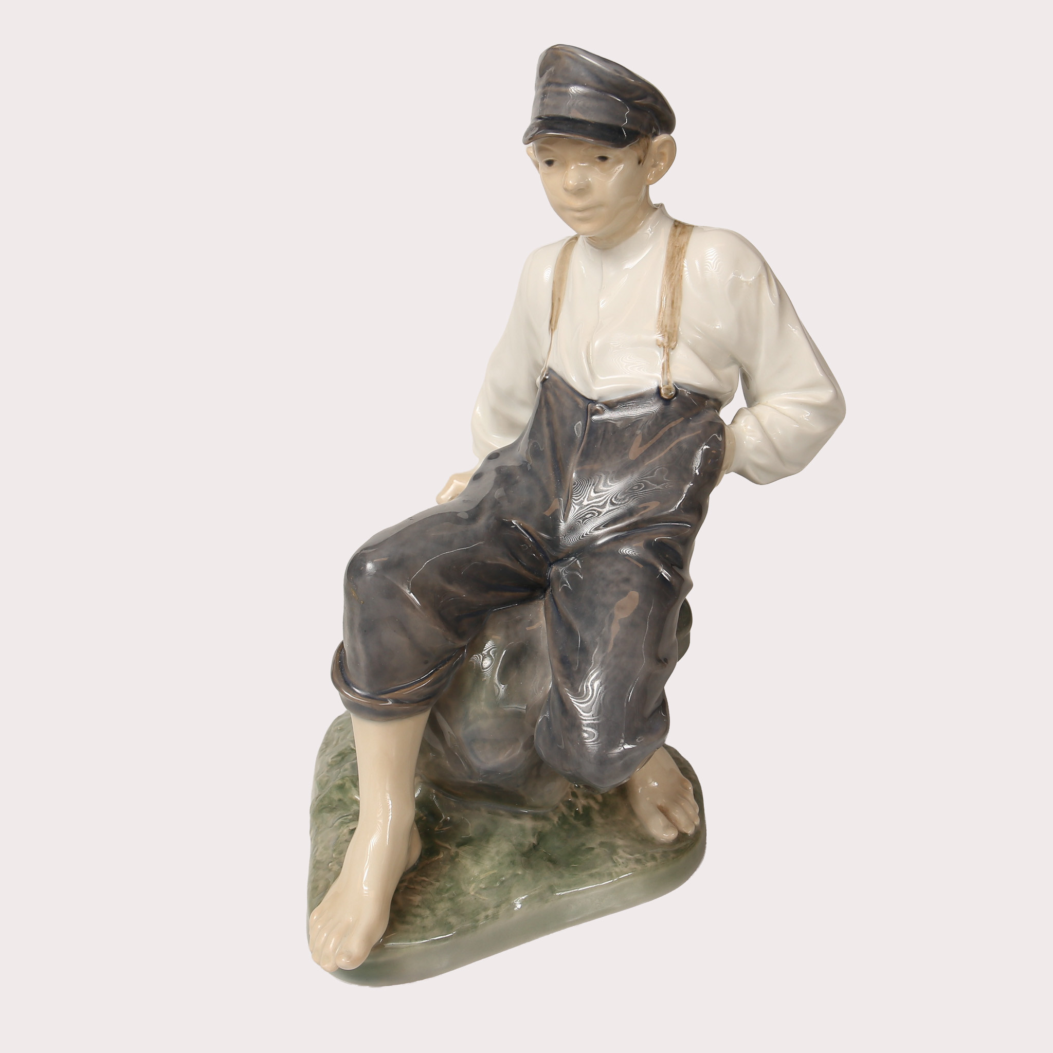 CHRISTIAN THOMSEN. Figurin, Porslin, Vallpojke modell nr 1659, Royal Copenhagen, Danmark.