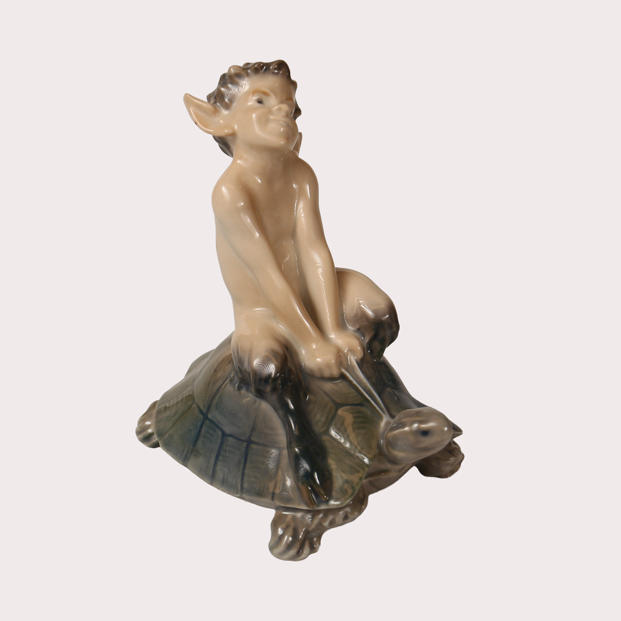 CHRISTIAN THOMSEN., Figurin porslin, modell nr 858 Faun på sköldpadda, Royal Copenhagen, Danmark.
