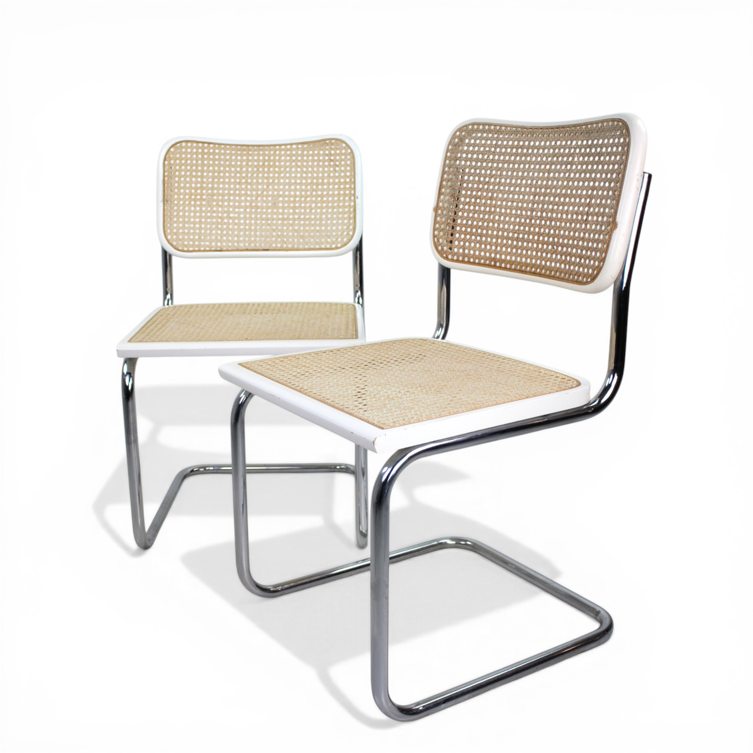 STOLAR, Bauhausstil, 2 st, vitmålade, stål, rotting, en djupstämplad Made in Italy, 1900-tal.