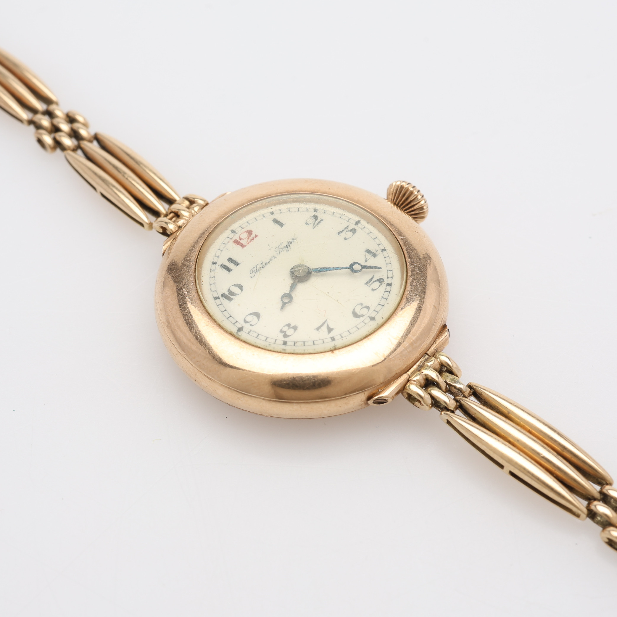 ARMBANDSUR & ARMBAND AV 14K GULD, PAVEL BUHRE, MANUELLT UPPDRAG, ANKARGÅNG, 1900-TALETS FÖRSTA DEL, TOTALT 34,1 GRAM.