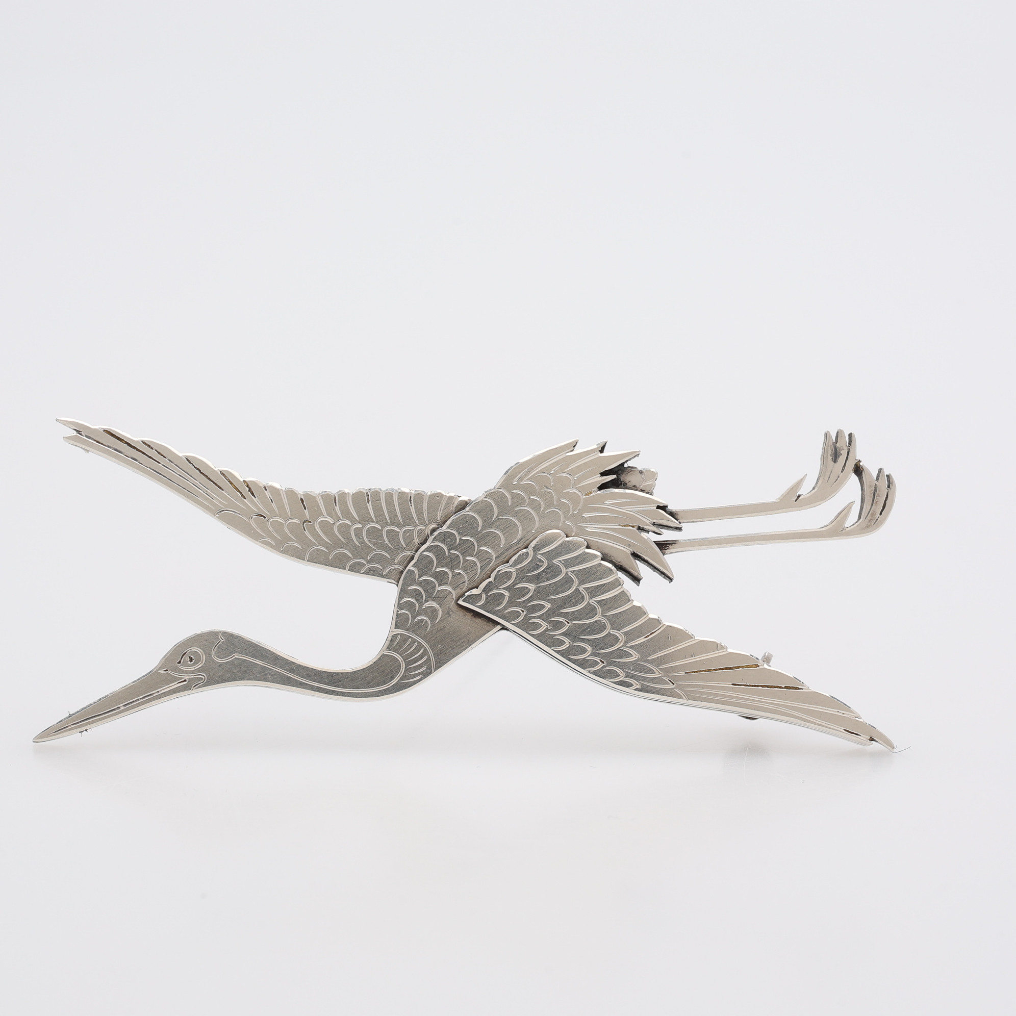 WIWEN NILSSON. BROSCH, STERLINGSILVER, I FORM AV TRANA, STÄMPELSIGNERAD, LUND, 1972.