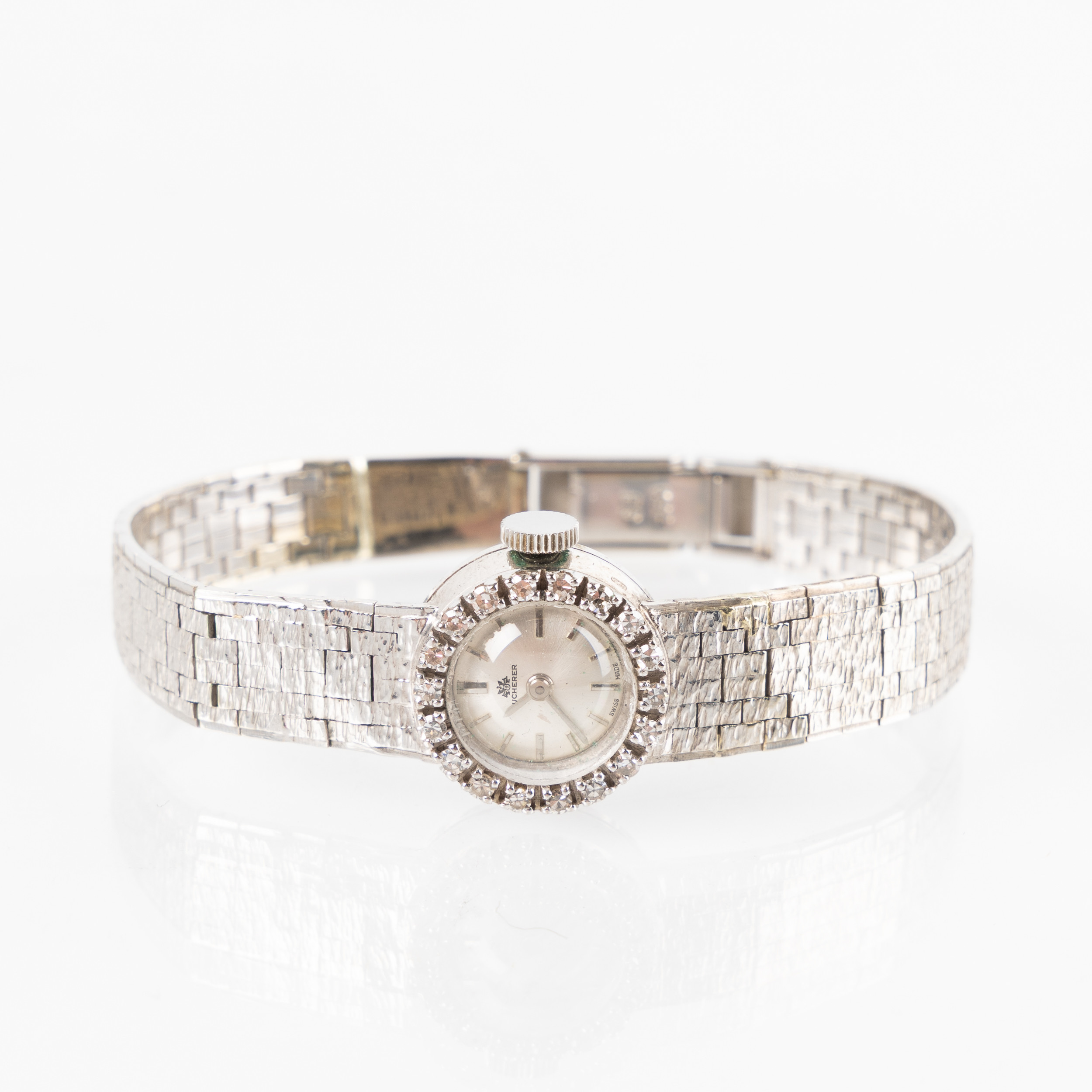 BUCHERER, smyckesur, 18K vitguld, diamantkrans, ca 1965.