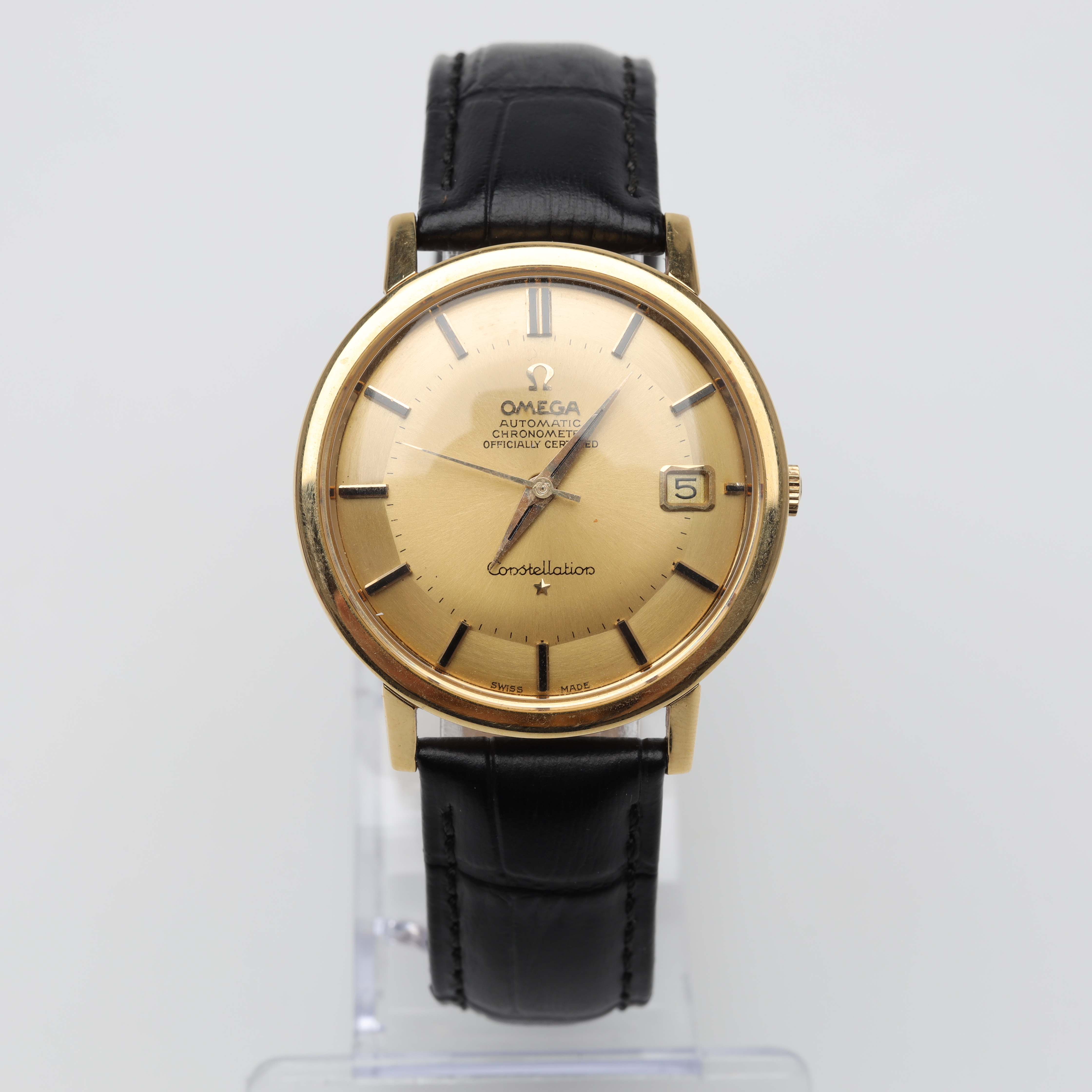 HERRUR Omega Constellation pie-pan 18K guld med läderband.