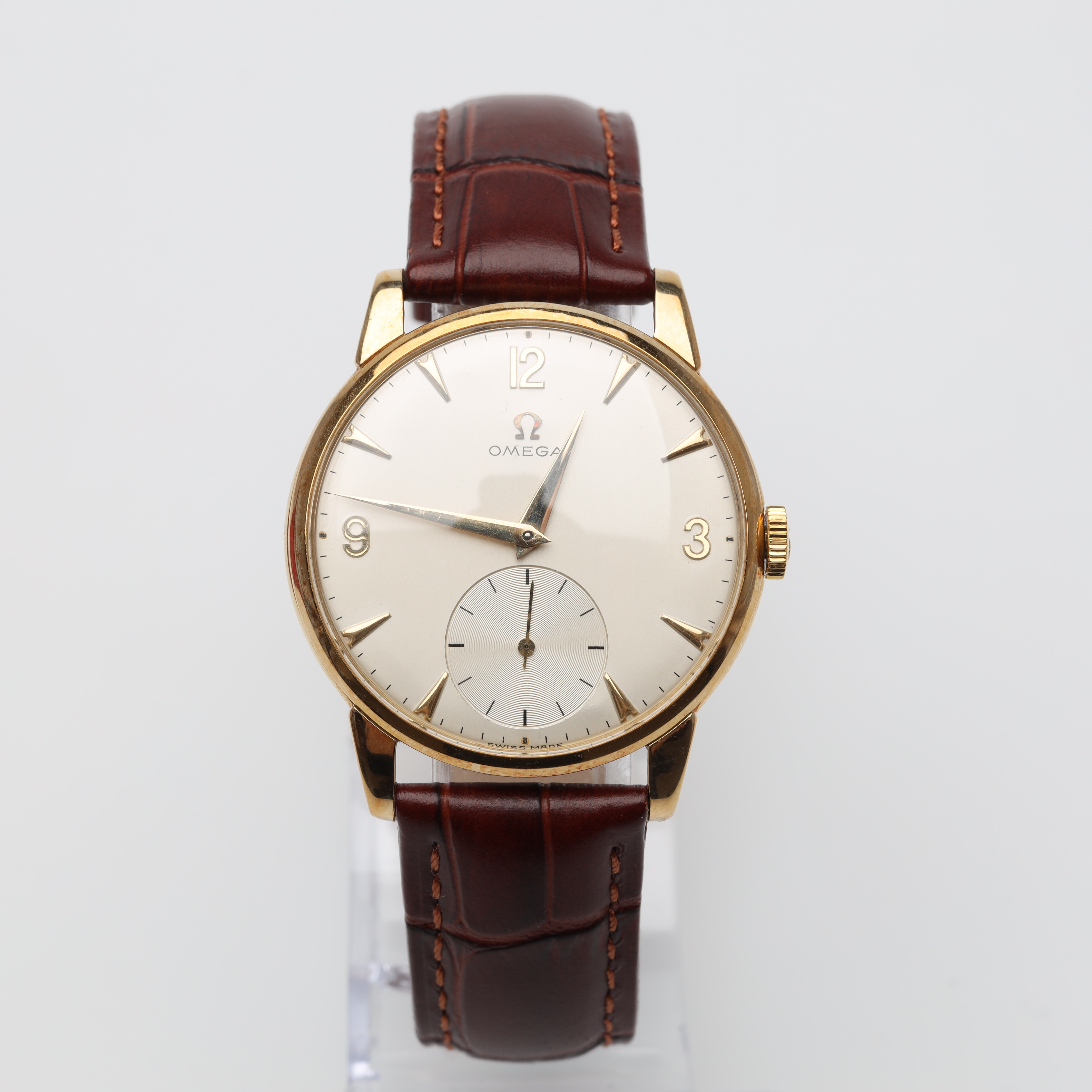 HERRUR Omega manuell 14K guld med läderband.