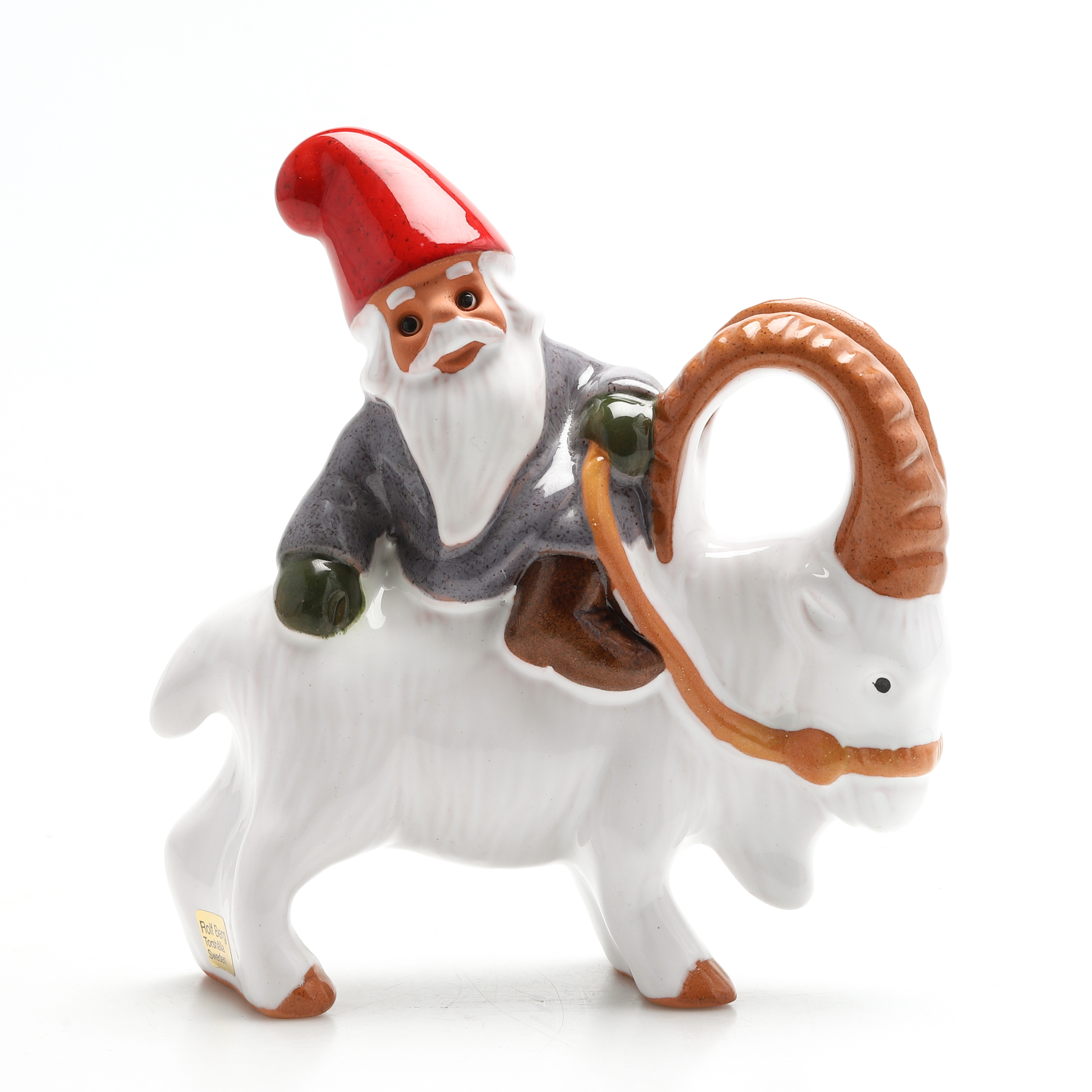 ROLF BERG. FIGURIN, tomte på julbock, delvis glaserad keramik.
