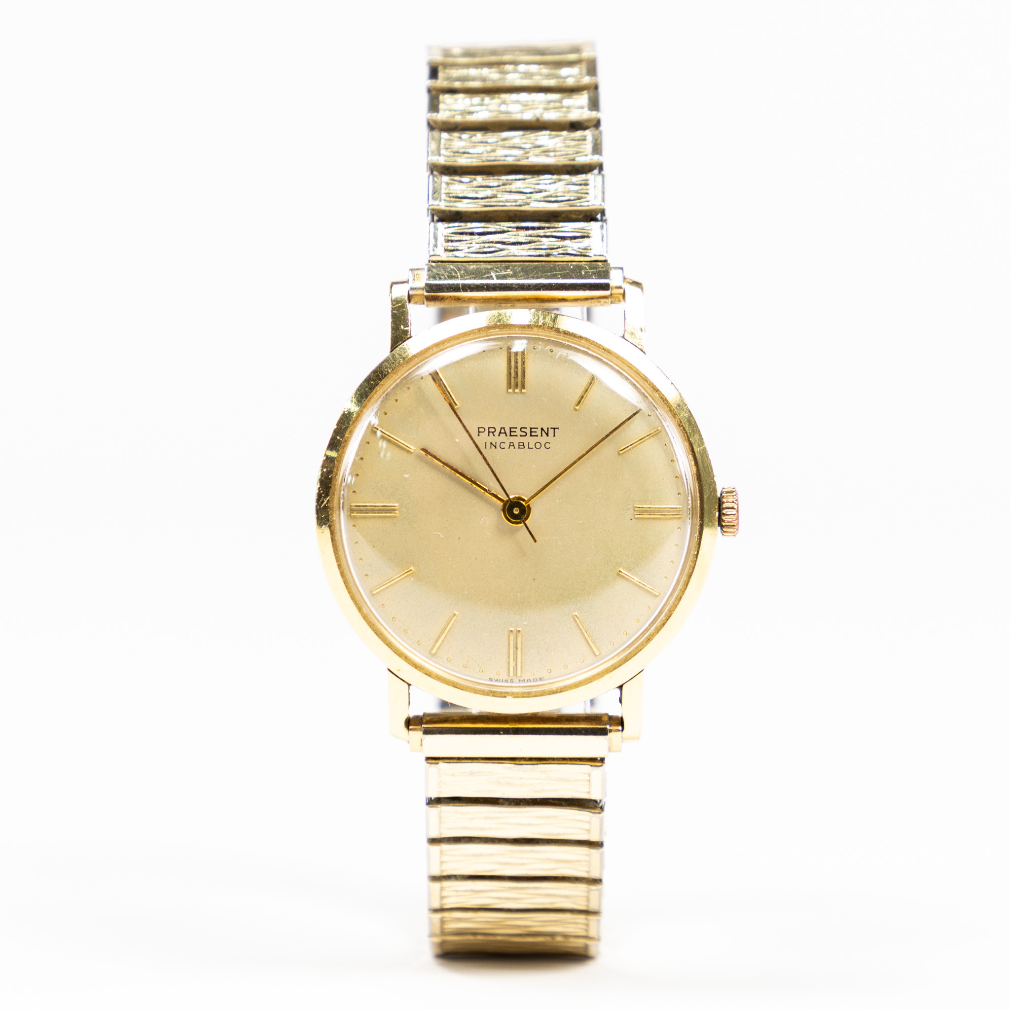 PRAESENT. 34 mm, 18k guld.