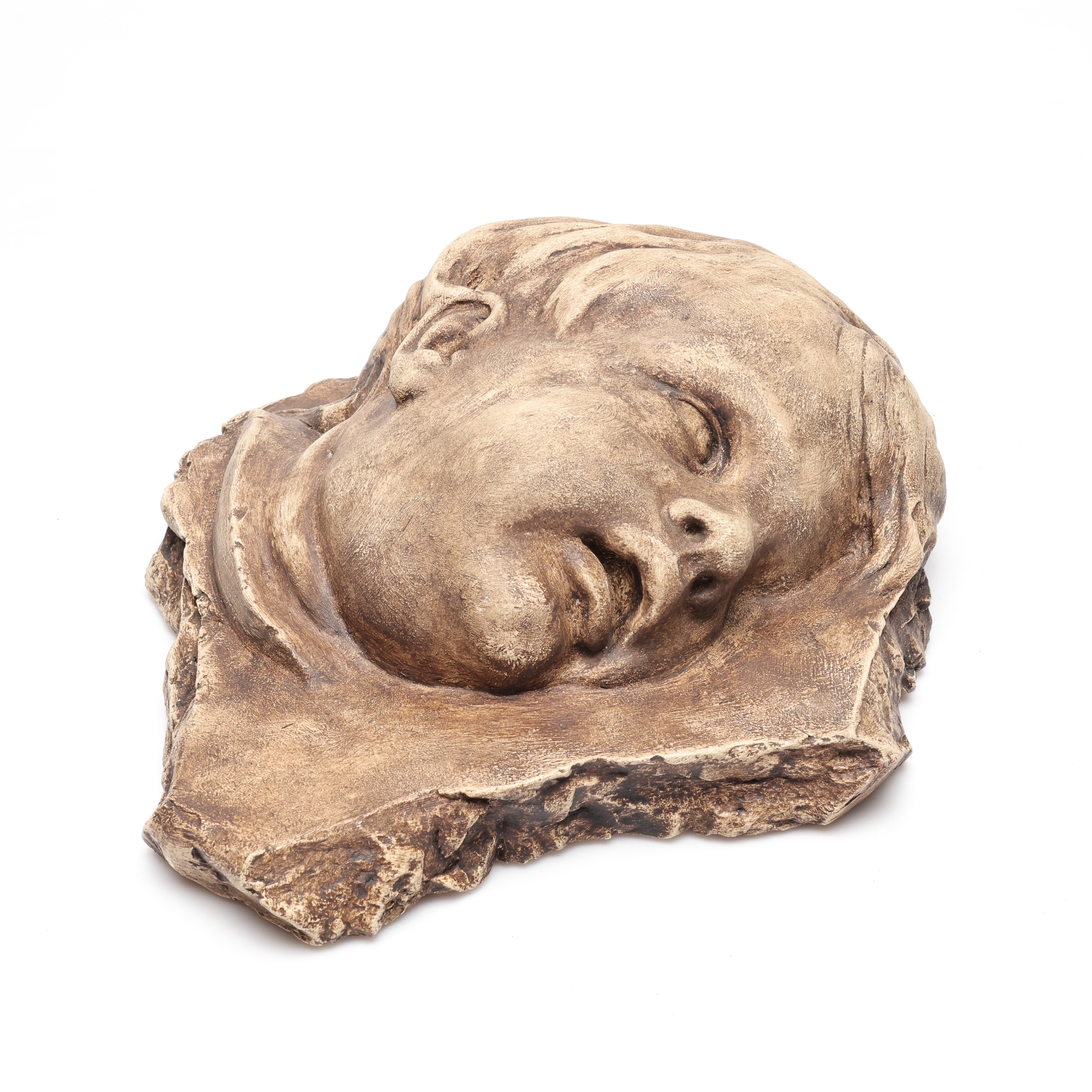 OIDENTIFIERAD KONSTNÄR. Relief, motiv av barnansikte, otydligt signerad med blyerts.