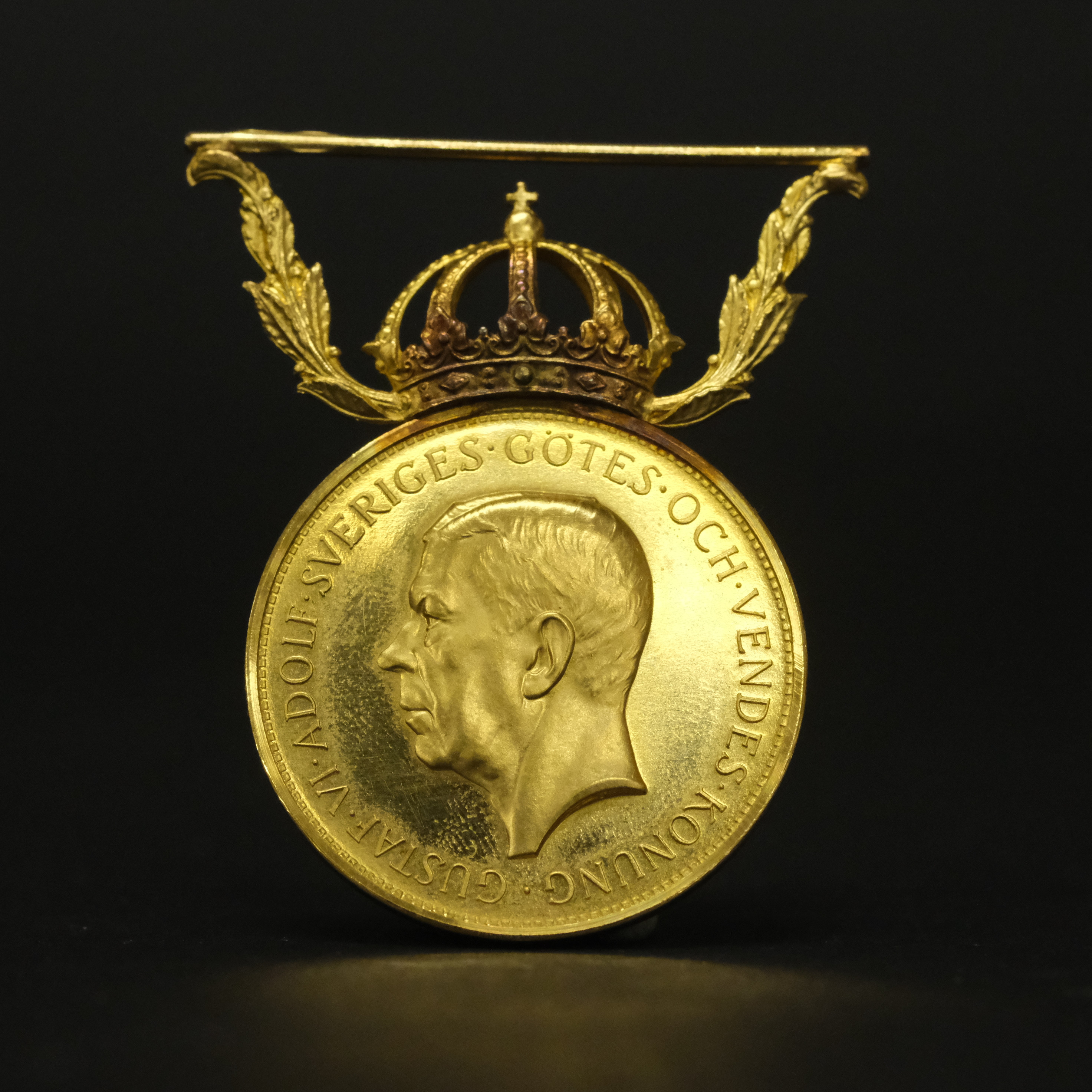 FÖRTJÄNSTMEDALJ, 23K / 18K GULD.