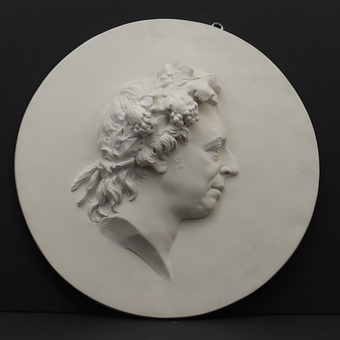 JOHAN TOBIAS SERGELL. Medaljong, föreställande Bellman, gips. Signerad och daterad 1782.
