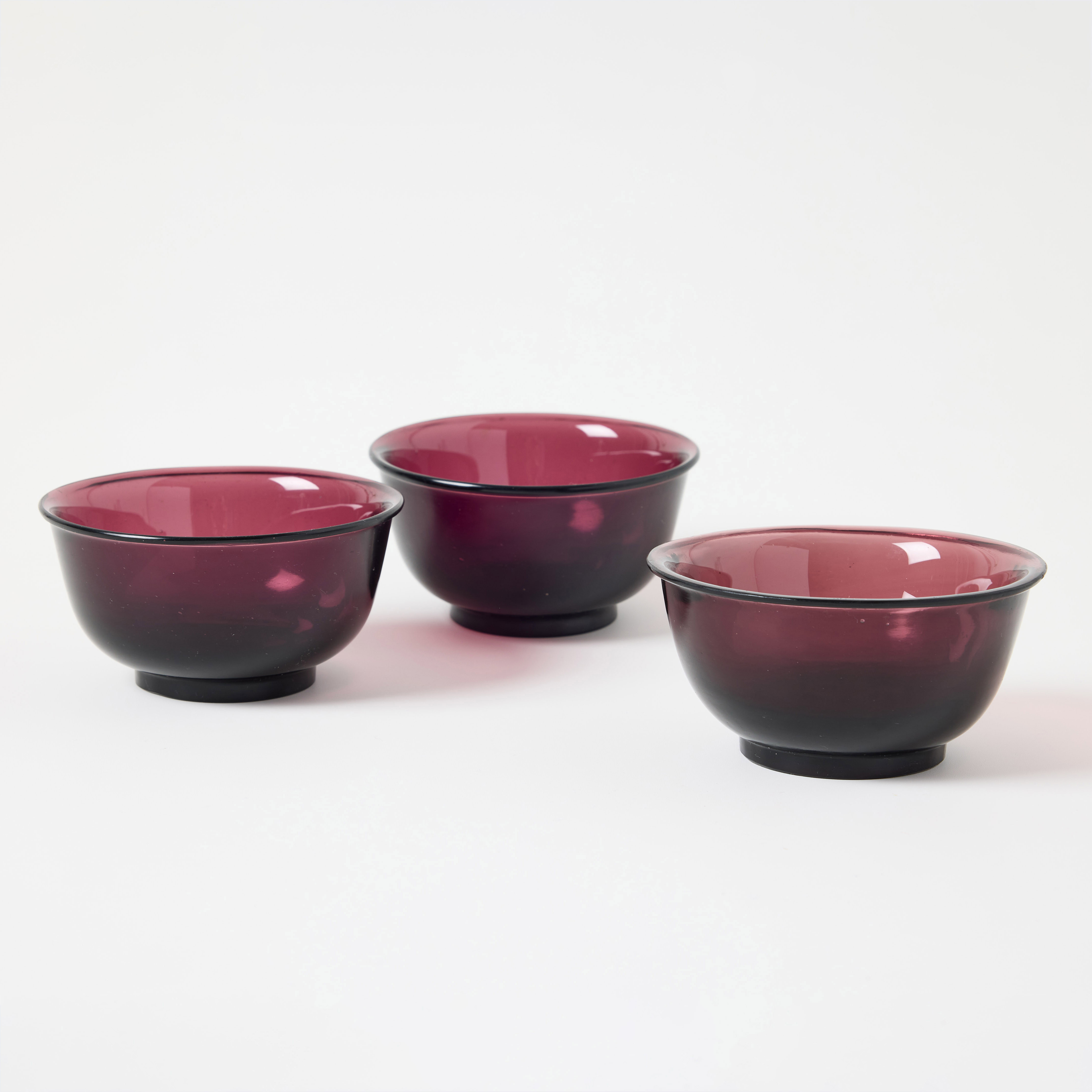 Three Chinese Purple Translucent Glass Bowls.