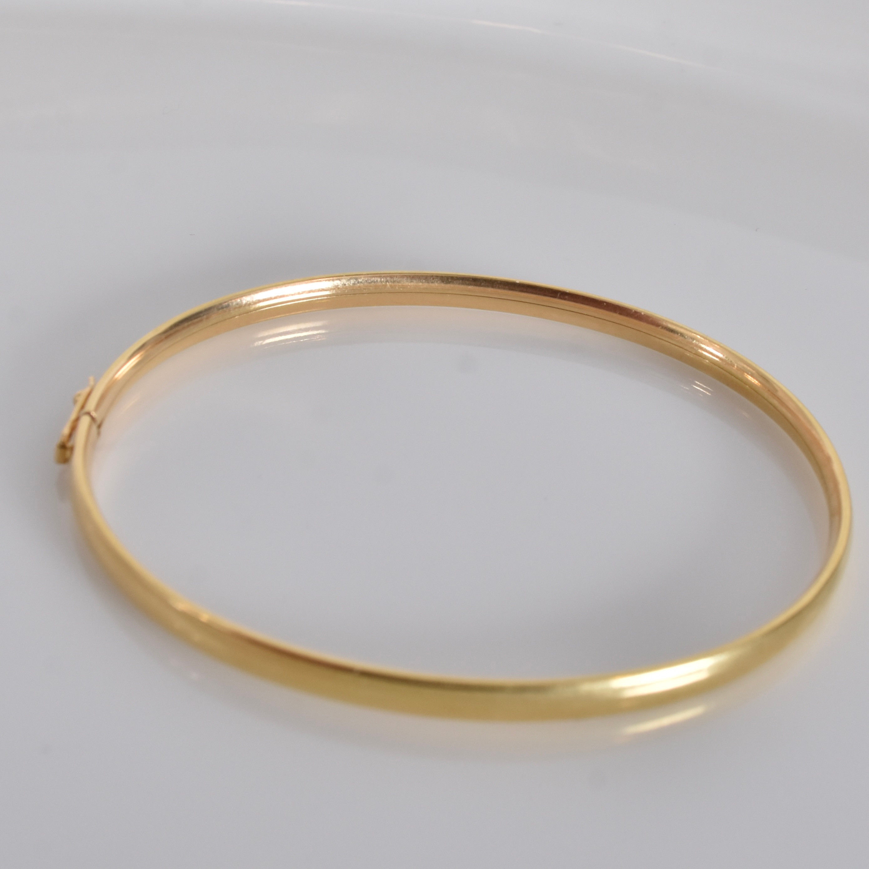 ARMRING, 18 karat rödguld.