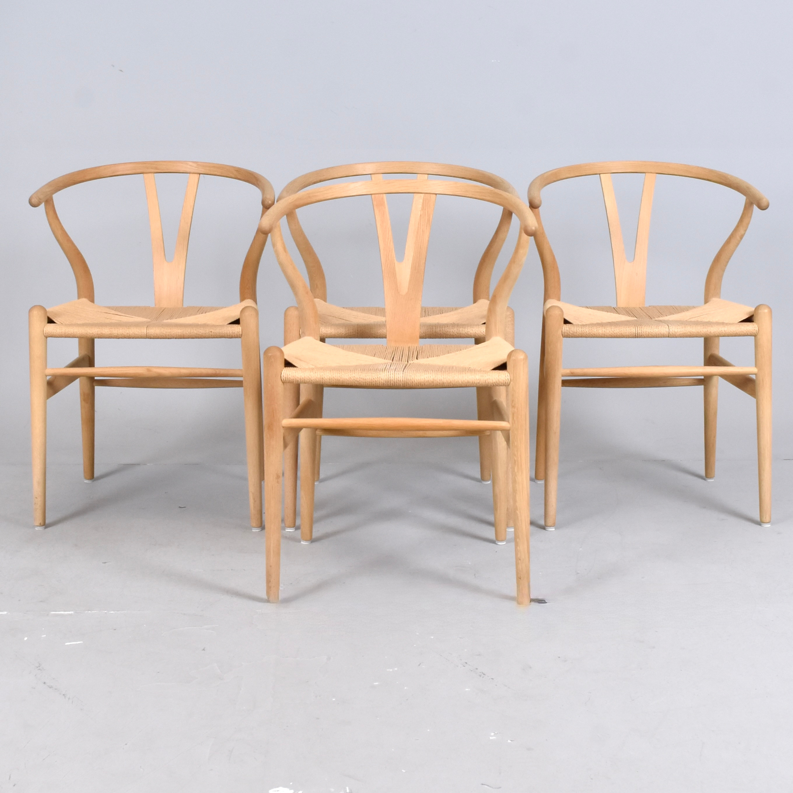 HANS J WEGNER. ARMSTOLAR, 4 st, såpad ek med flätad papperssits, modell CH24, "Y-stolen".