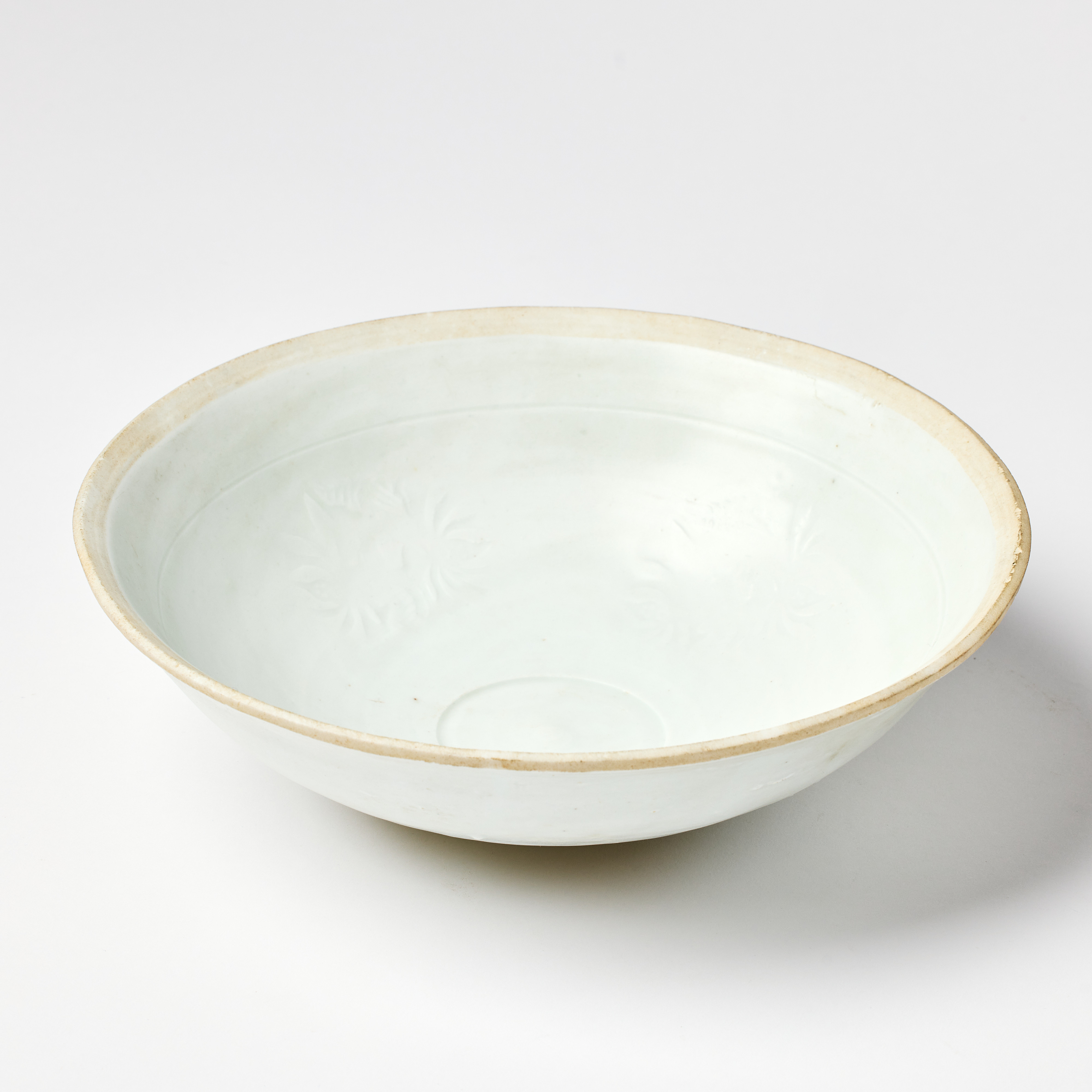 A Chinese White-Glazed 'Lotus' Bowl.