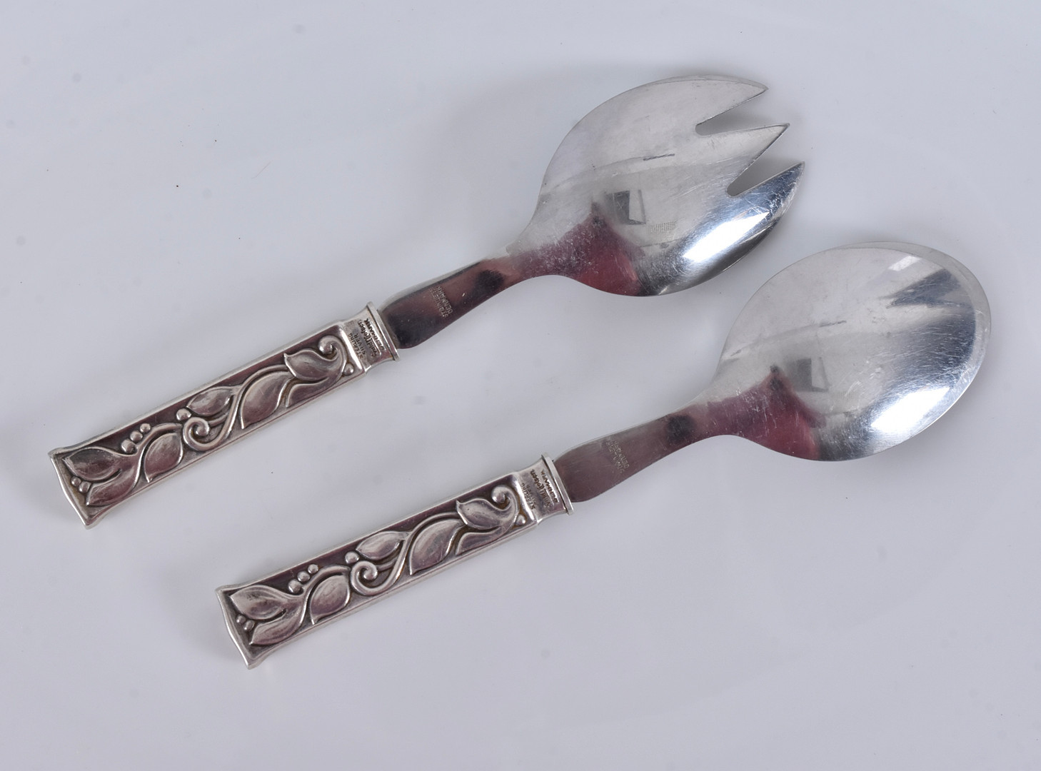 EVALD NIELSEN. serveringsbestick, 1 par, sterlingsilver och rostfritt stål, modell no 30 (leaf).