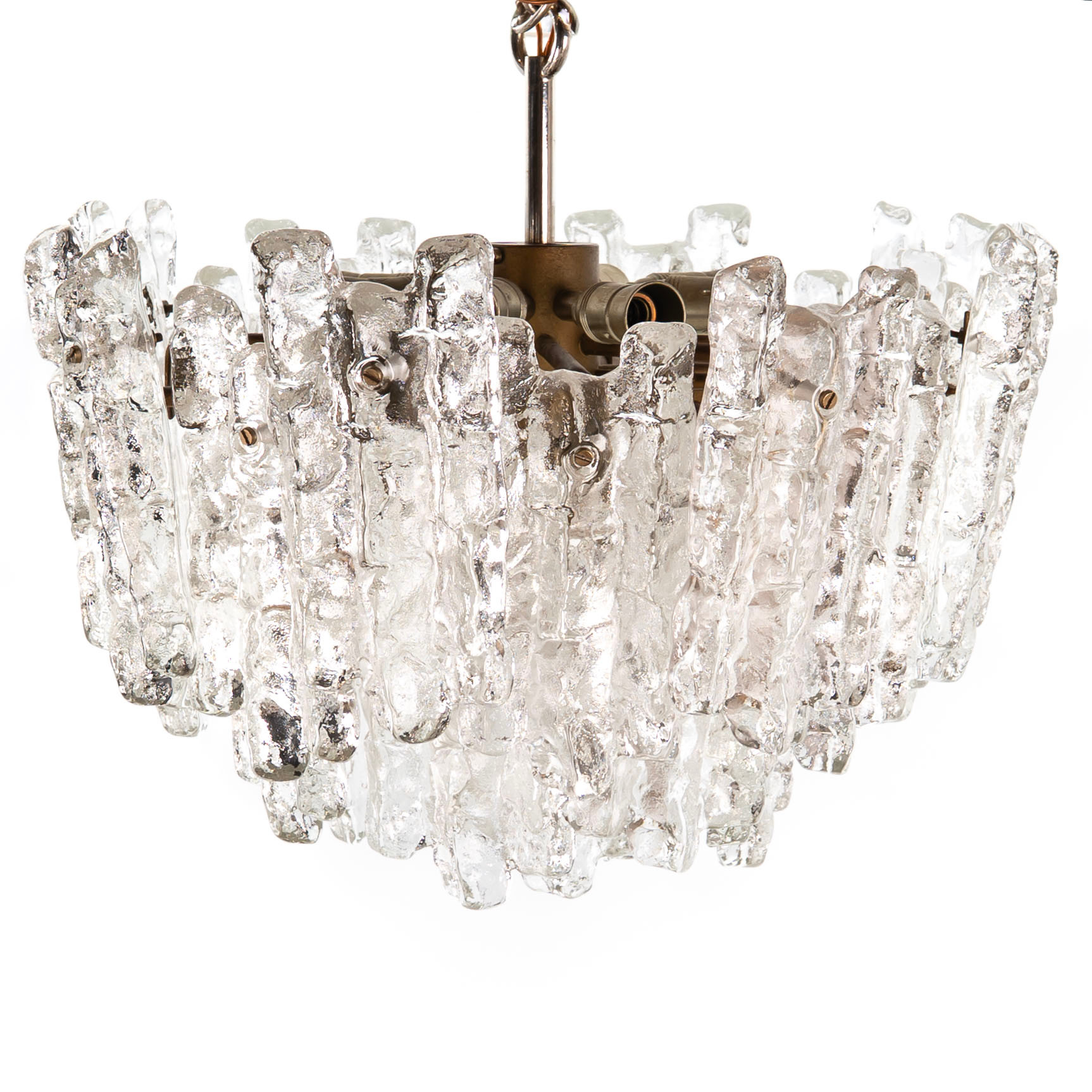 TAKLAMPA, "Ice block chandelier", JT Kalmar, 1960/70-tal, gjutet glas samt mässing, 9 ljuspunkter.