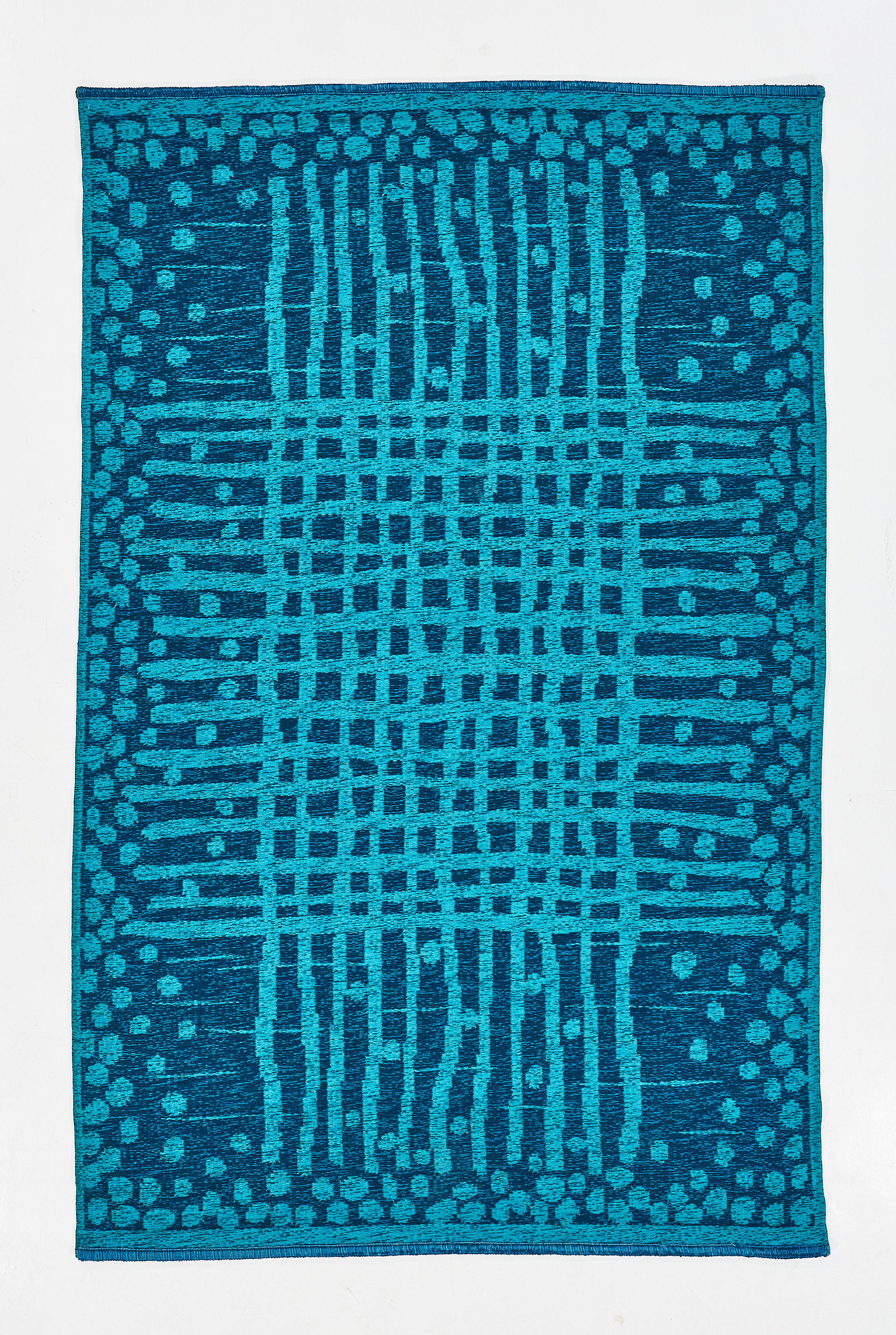 MATTA, dubbelvävd, dekor i turkost. 229 x 146 cm.