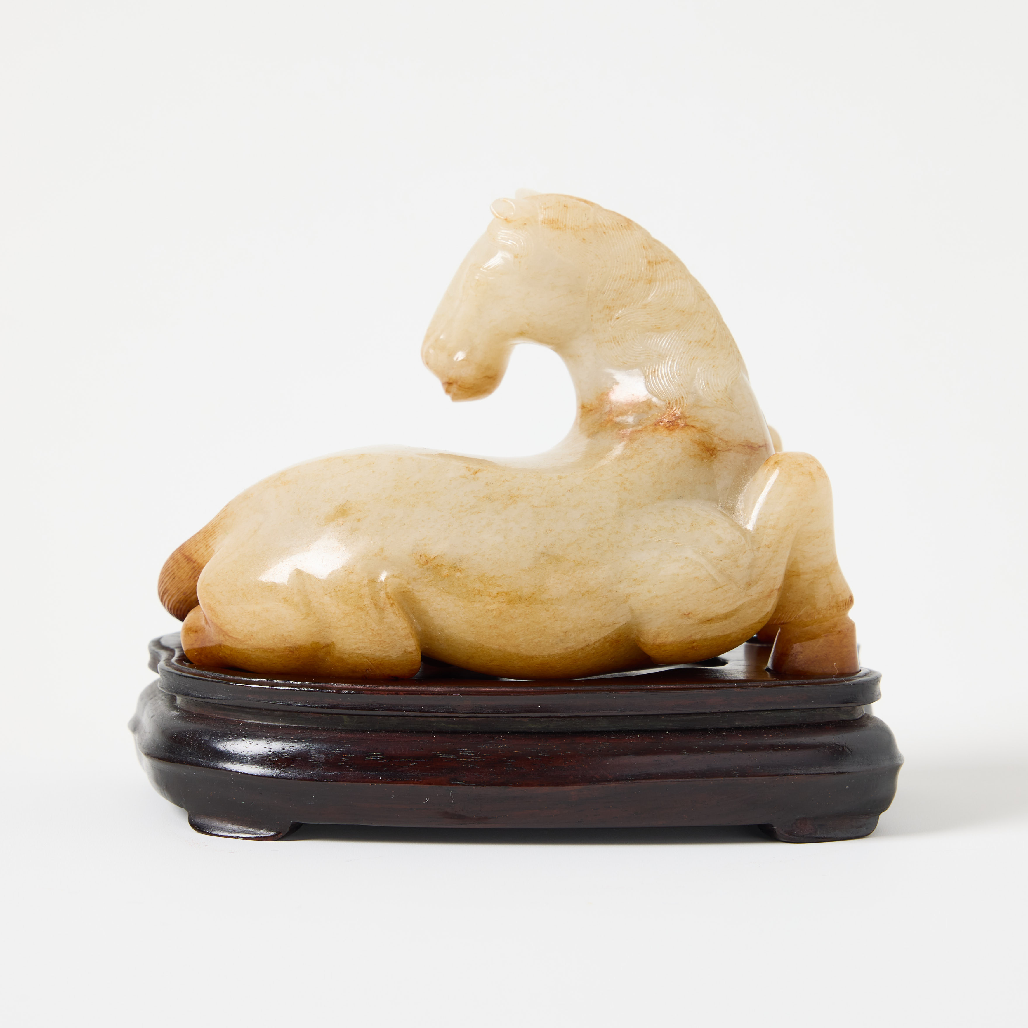 A Fine Chinese Jade Figure of a Recumbent Horse.