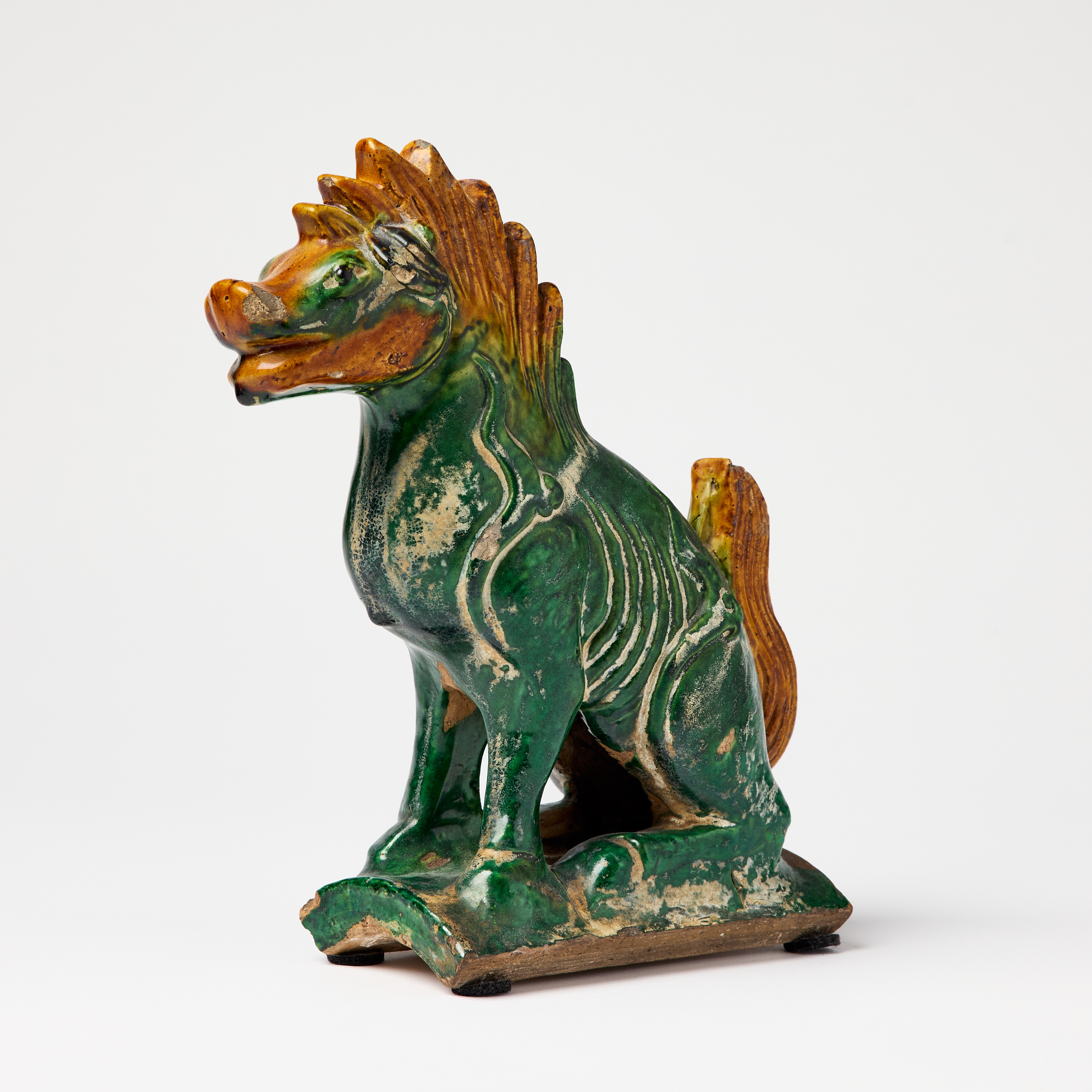 A Chinese Brown and Green Glazed Ridge Tile.