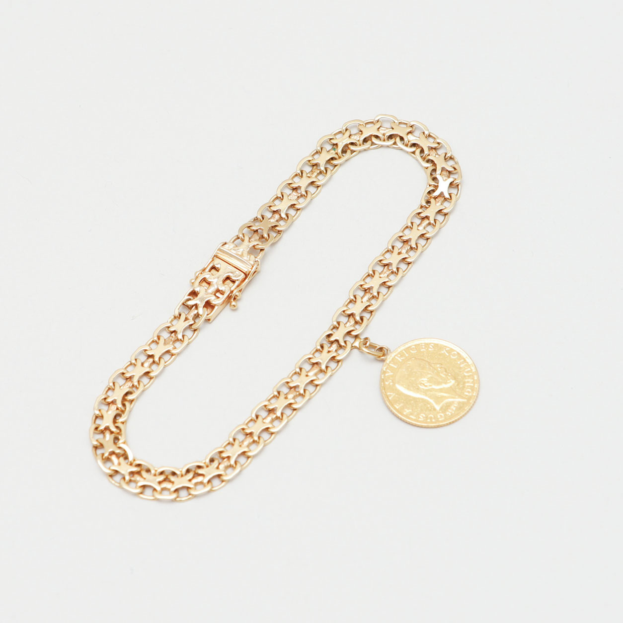 ARMLÄNK med mynt, 18-21,6k guld, vikt ca 11,7 gram.