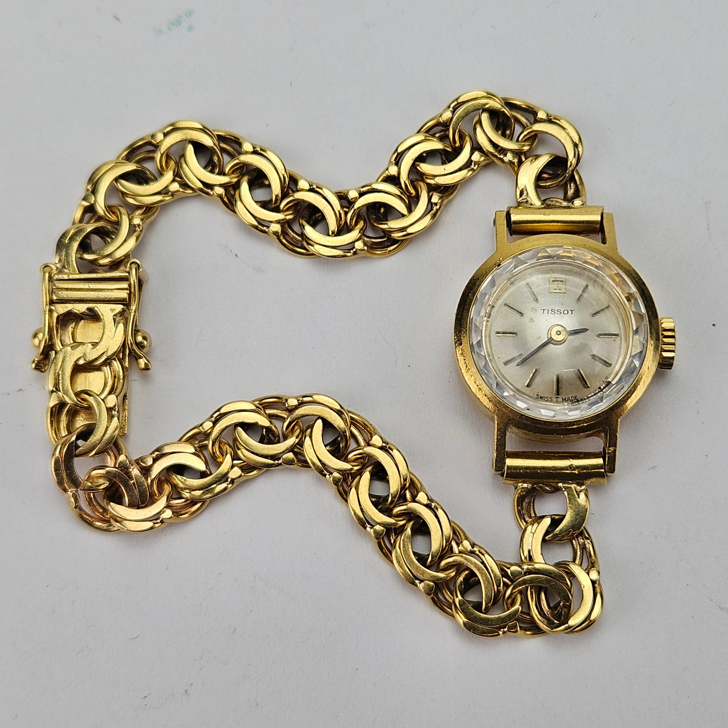 DAMARMBANDSUR, guld, 18K, Tissot, total vikt ca. 19,9 gram.