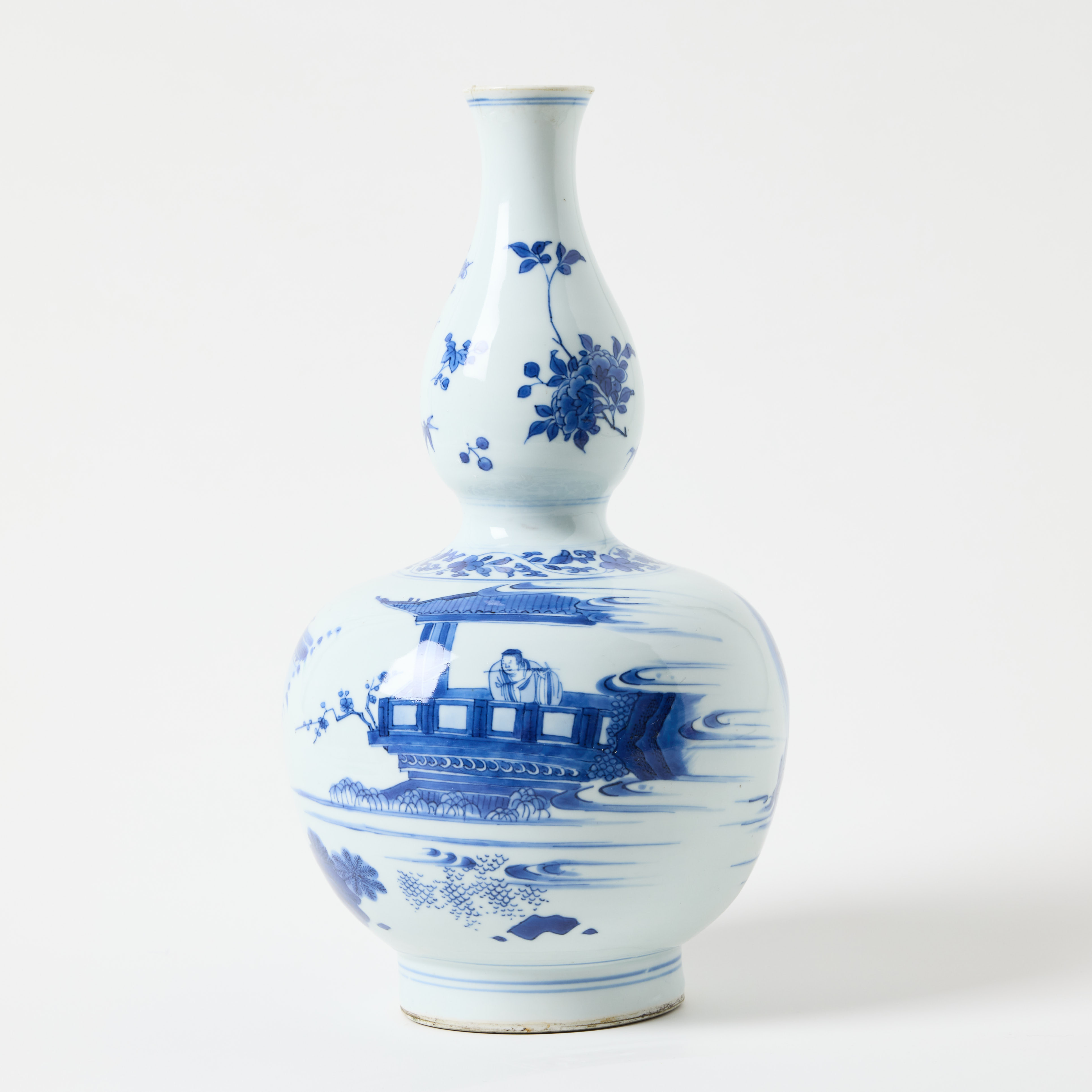 A Chinese Transitional Blue and White Double Gourd Vase.