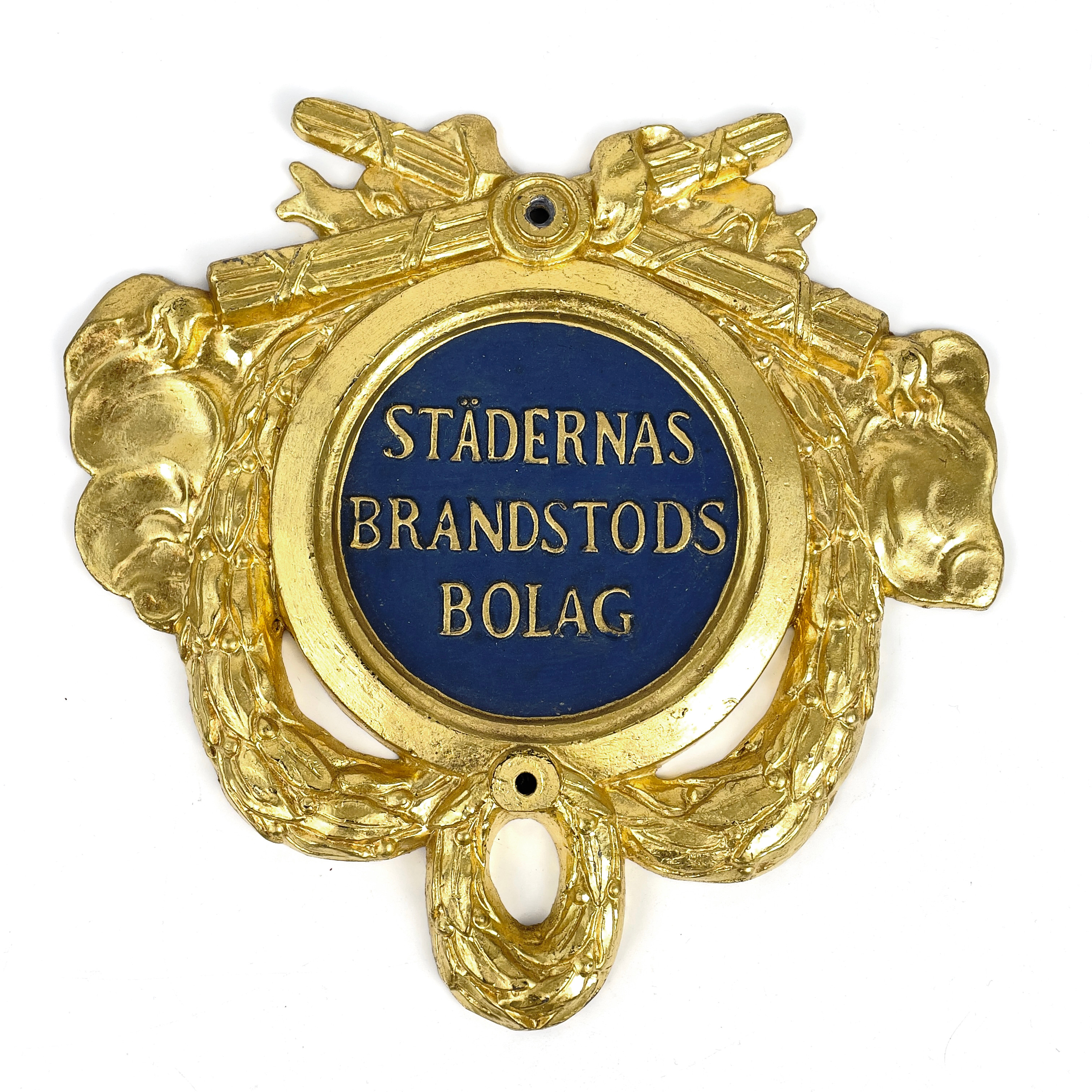 SKYLT, förgyllt och målat gjutjärn, "Städernas Brandstodsbolag", 1800-tal.
