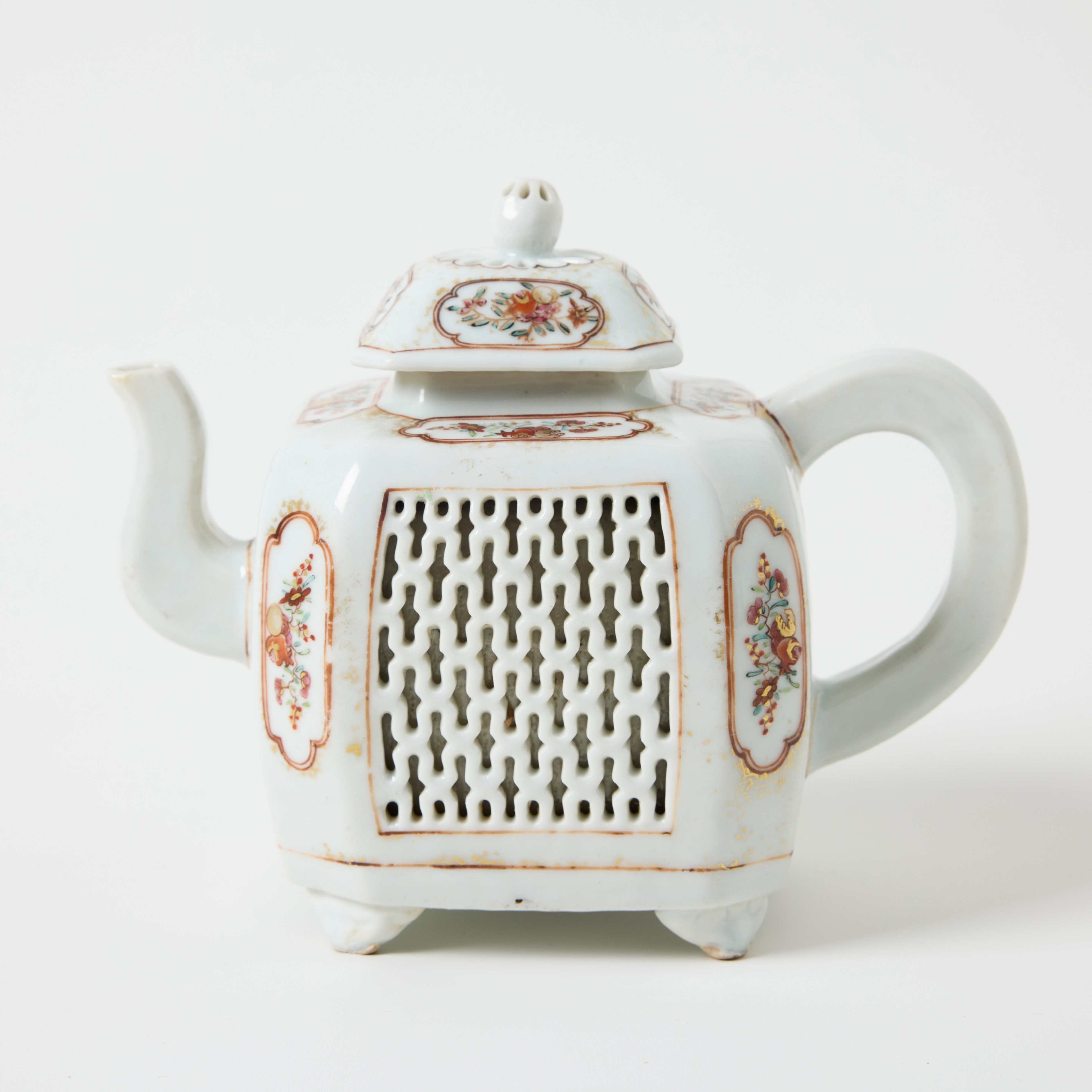 A Chinese Famille Rose Reticulated Teapot and Cover.