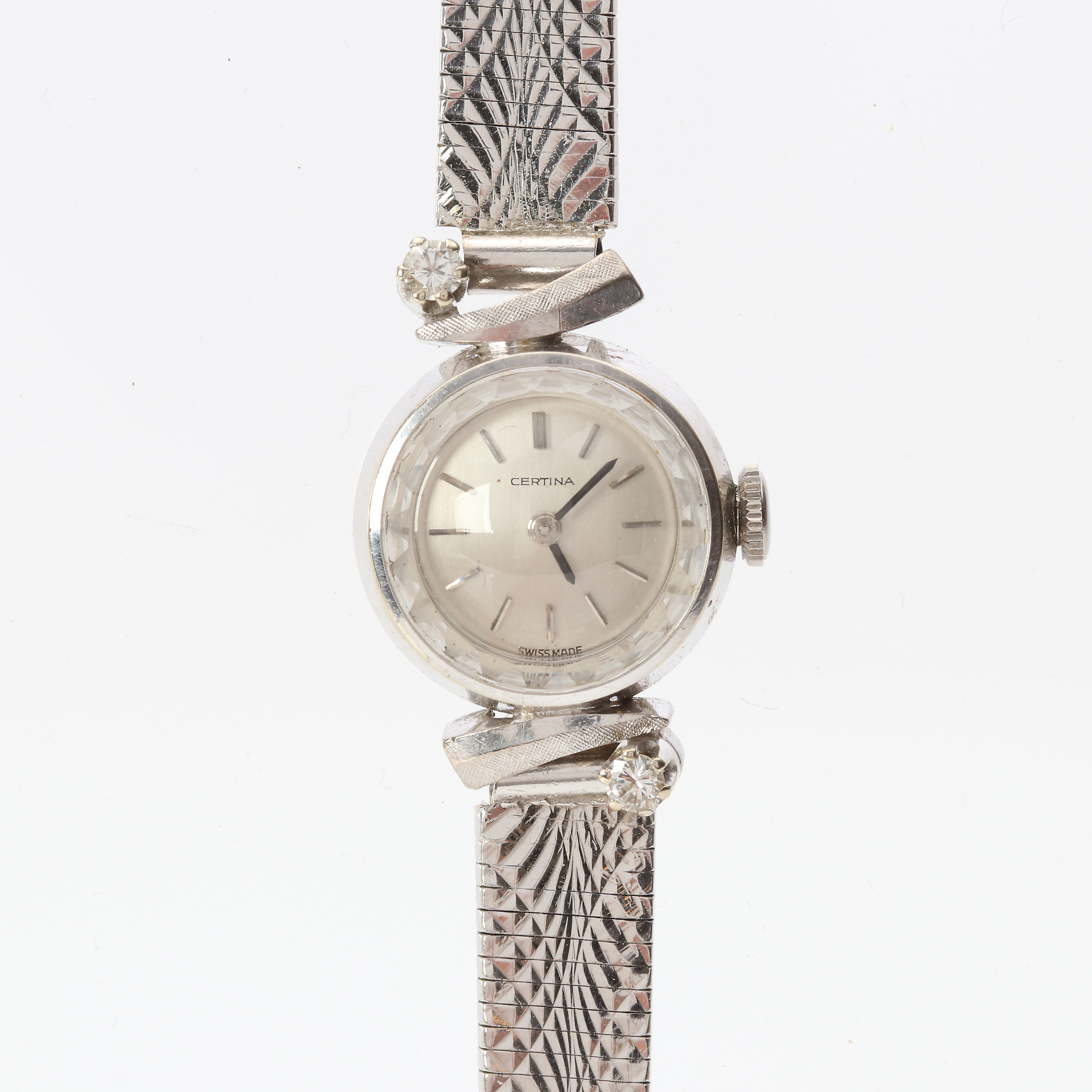 CERTINA, ARMBANDSUR. 18k vitguld med två briljantslipade diamanter, totalvikt ca 27,7 gram.
