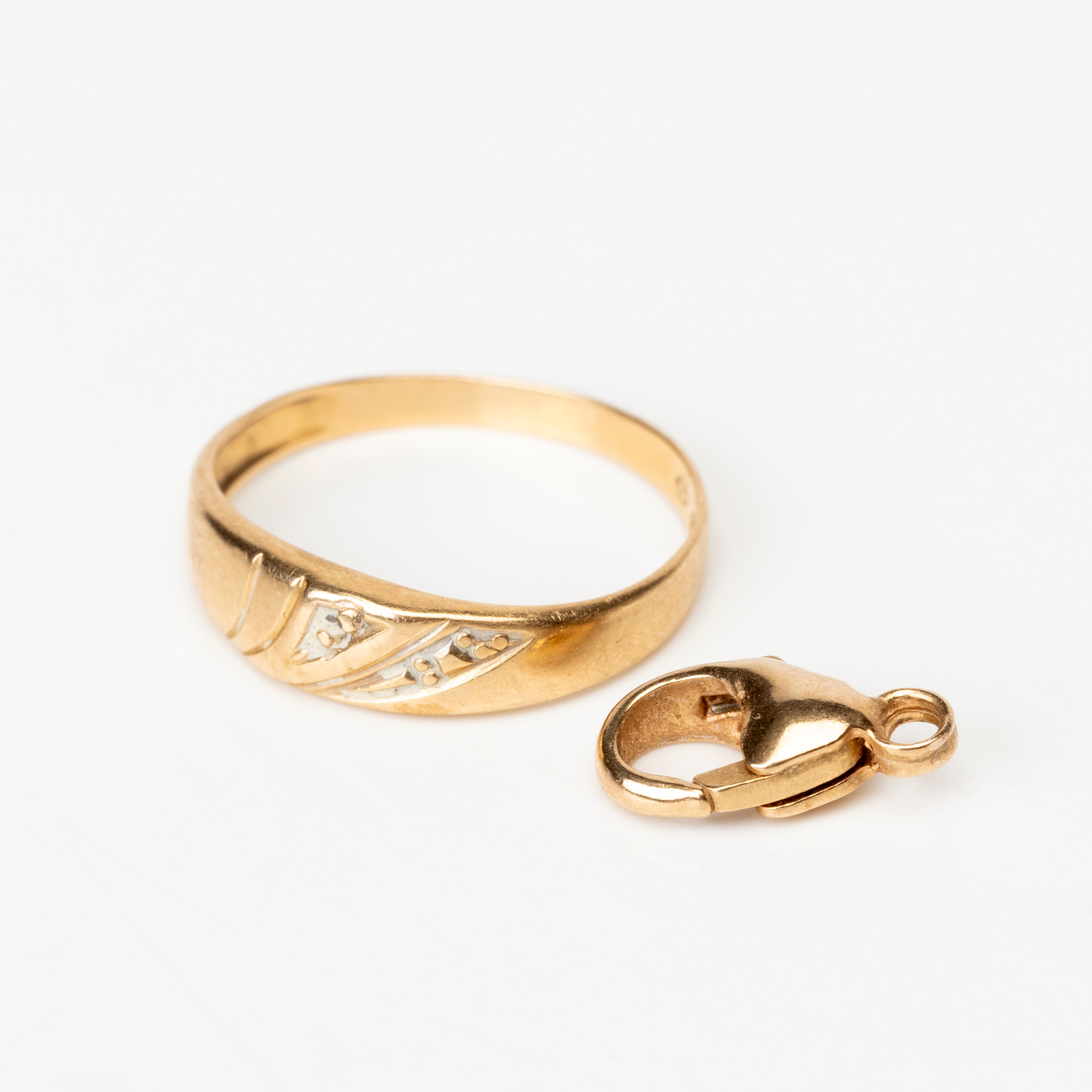 RING samt LÅS, 18K guld, 1900-tal.