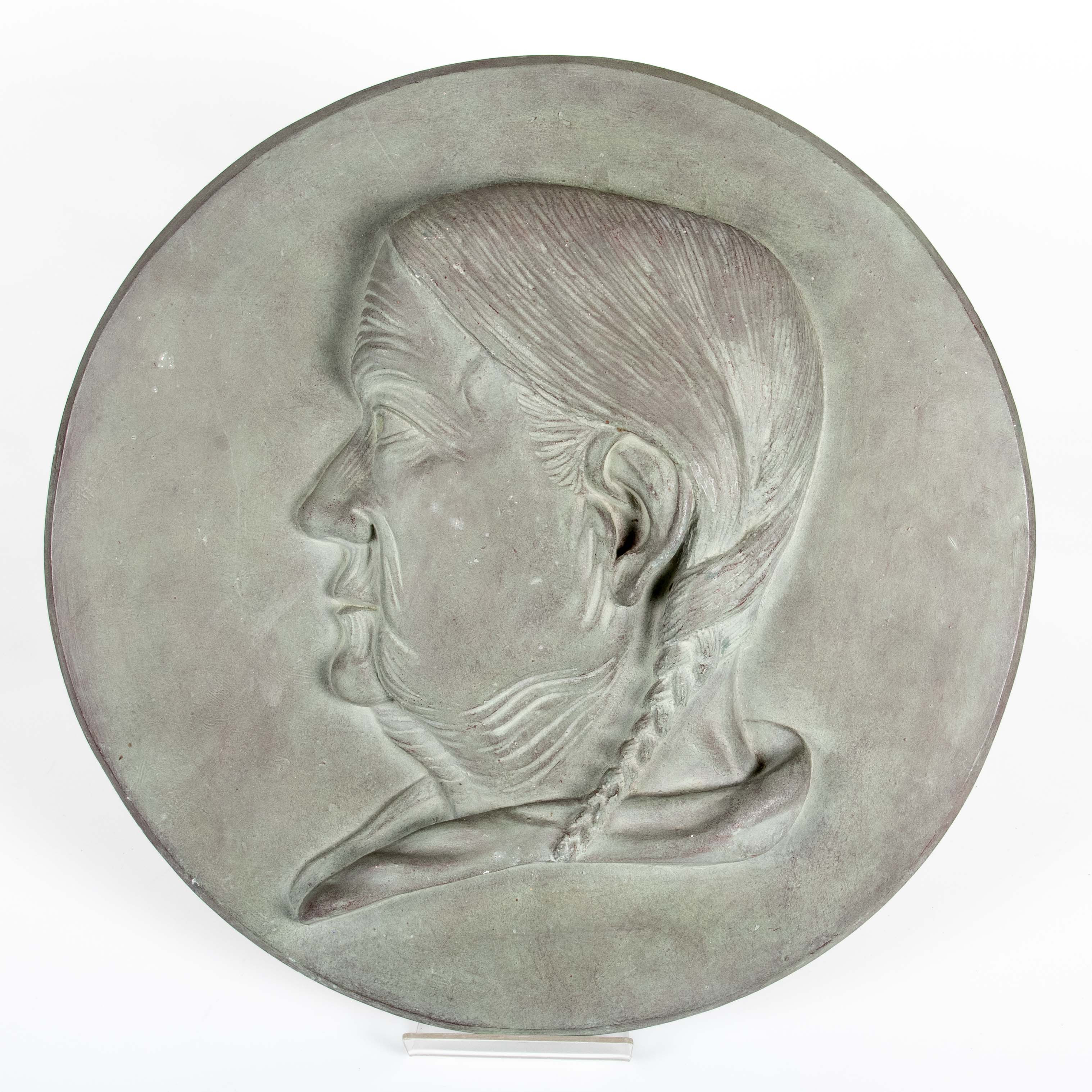 ANTON WAHLEDOW (1862-1923, KALMAR), väggmedaljong "Kvinna med fläta" 1886, patinerad gips.