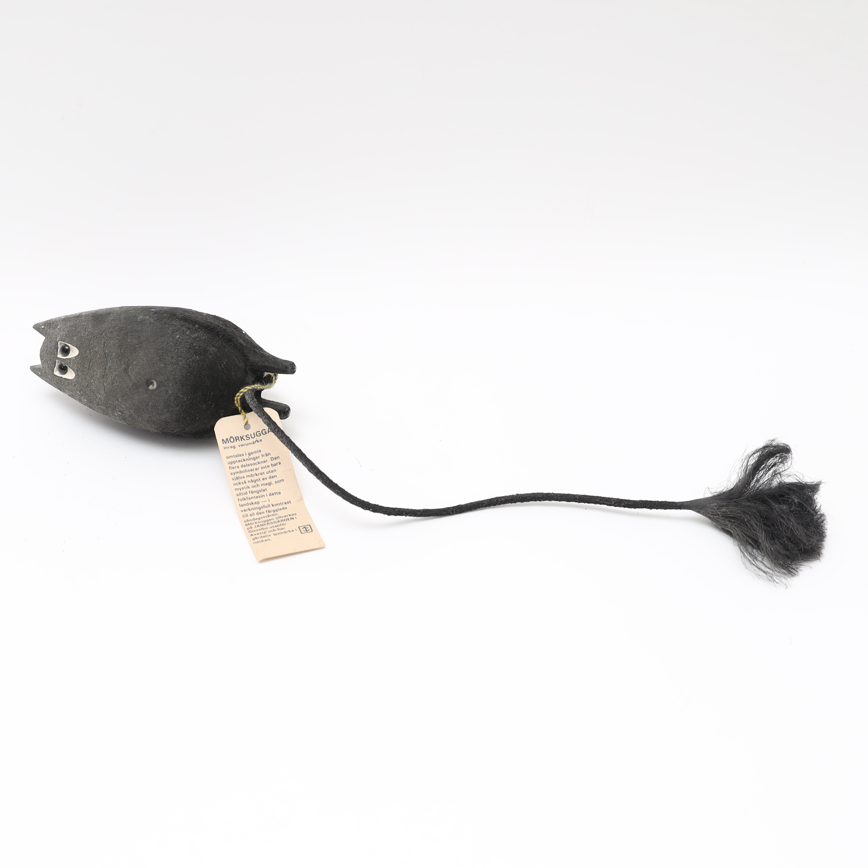 MÖRKSUGGA, skuret och svartlackat trä, samt metall.