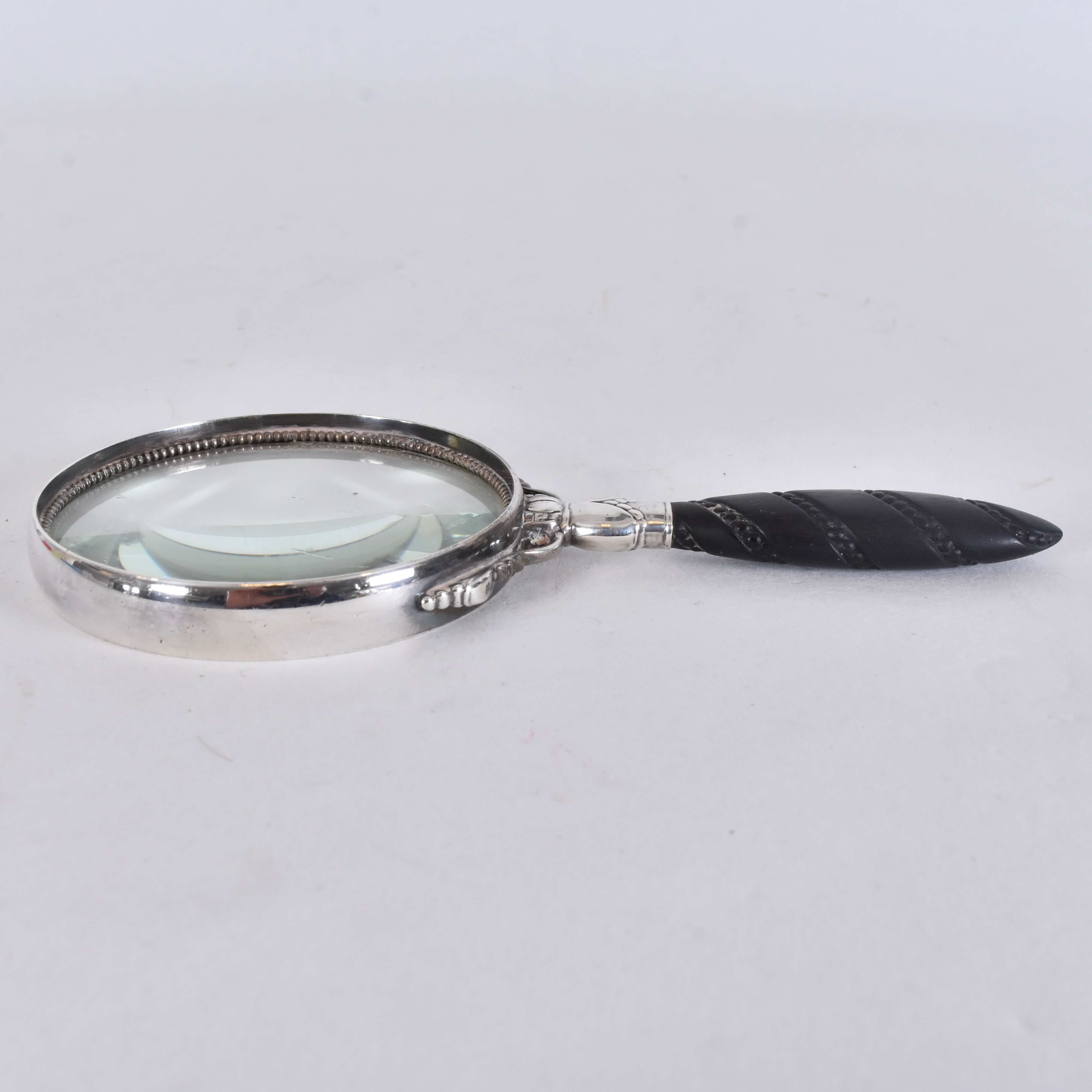 GEORG JENSEN. FÖRSTORINGSGLAS, sterlingsilver och ebenholz, dessin 74B.
