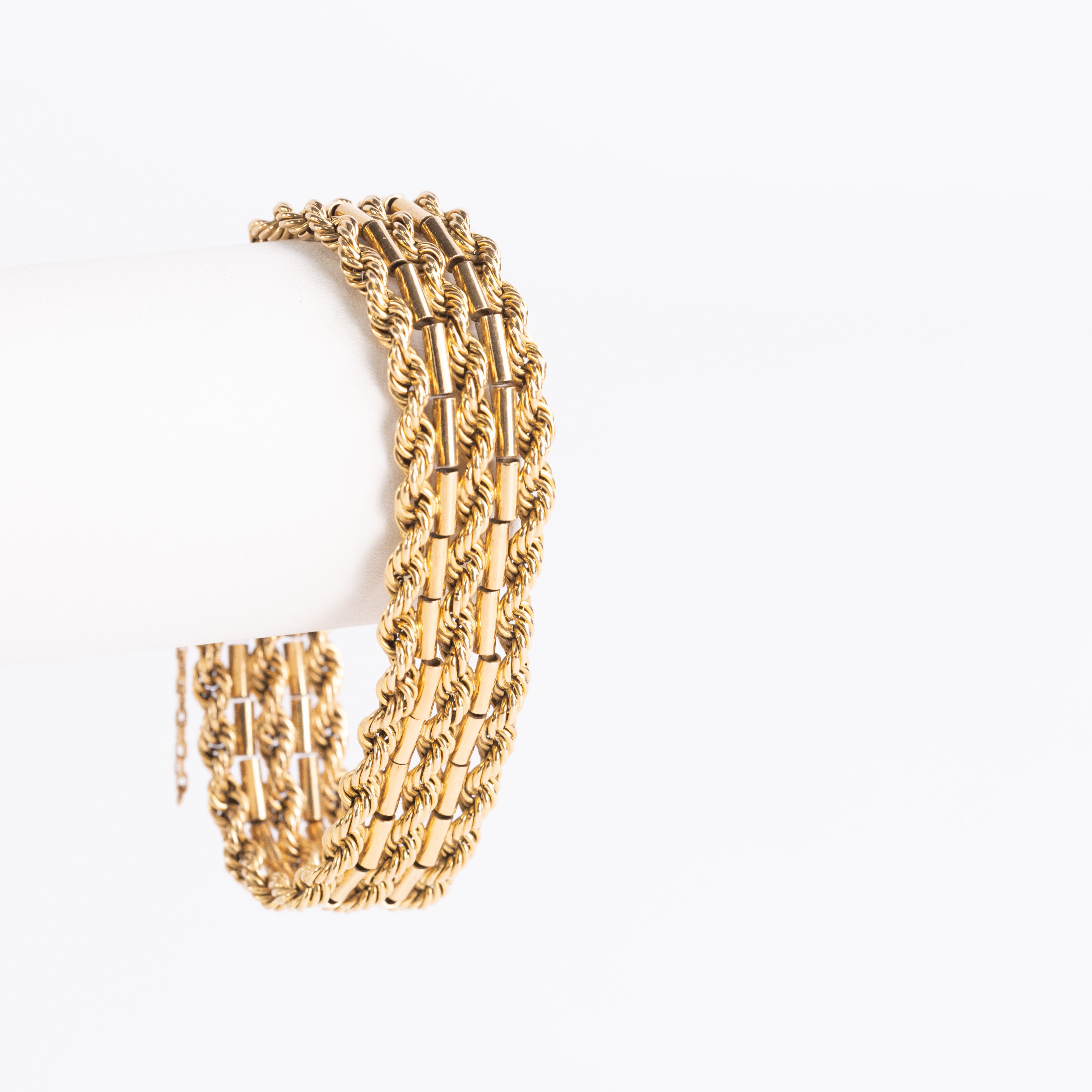 ARMBAND. Treradig cordell, 18k guld.