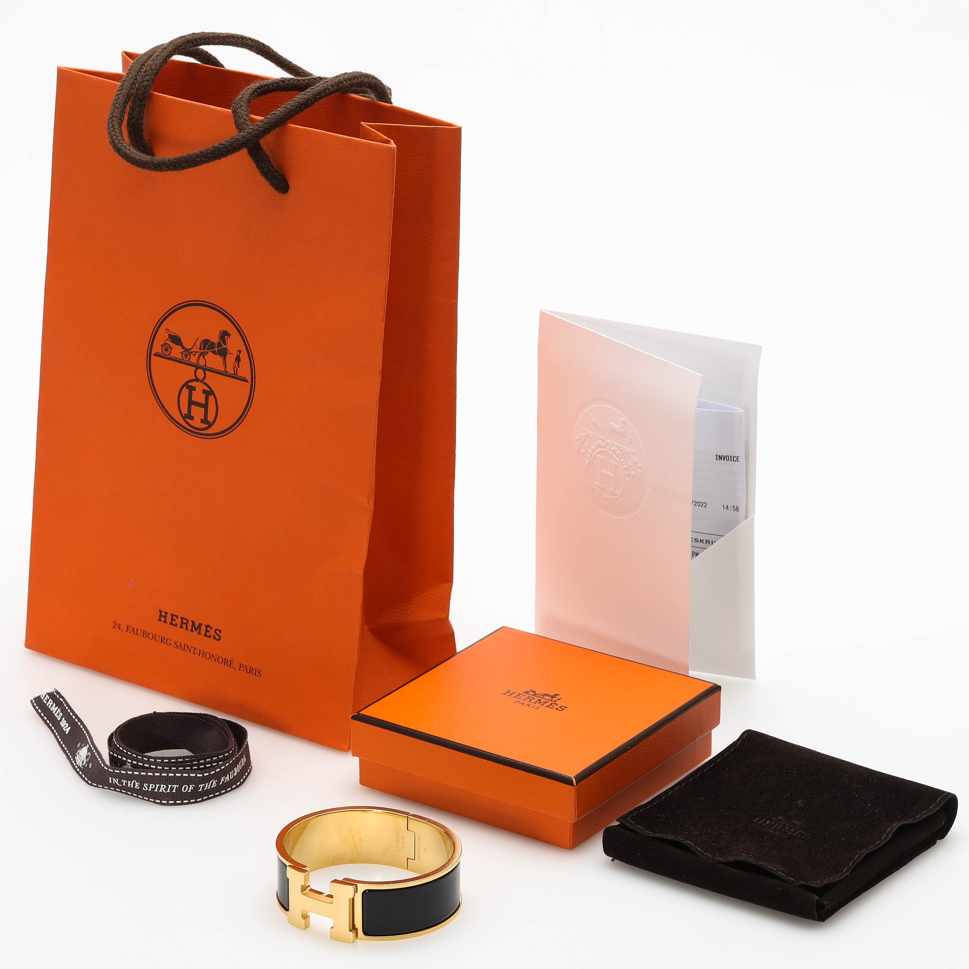 HERMÈS. Clic Clac H, armring, guldpläterad metall med svart emalj, kvitto, ask, Frankrike.
