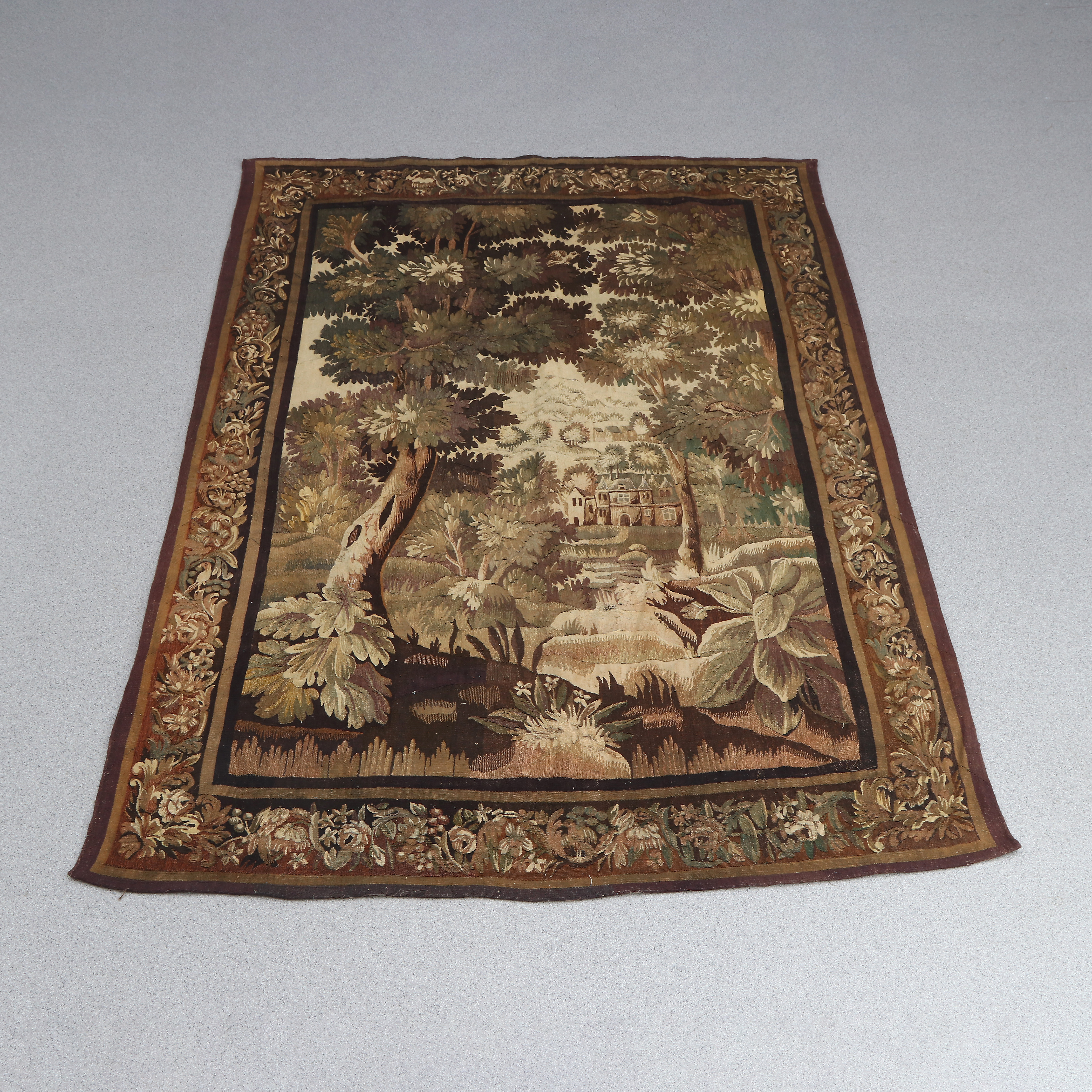 VÄGGTEXTIL. Vävd i ull. 17/1800-tal. Skogslandskap med utsikt mot herrgård.