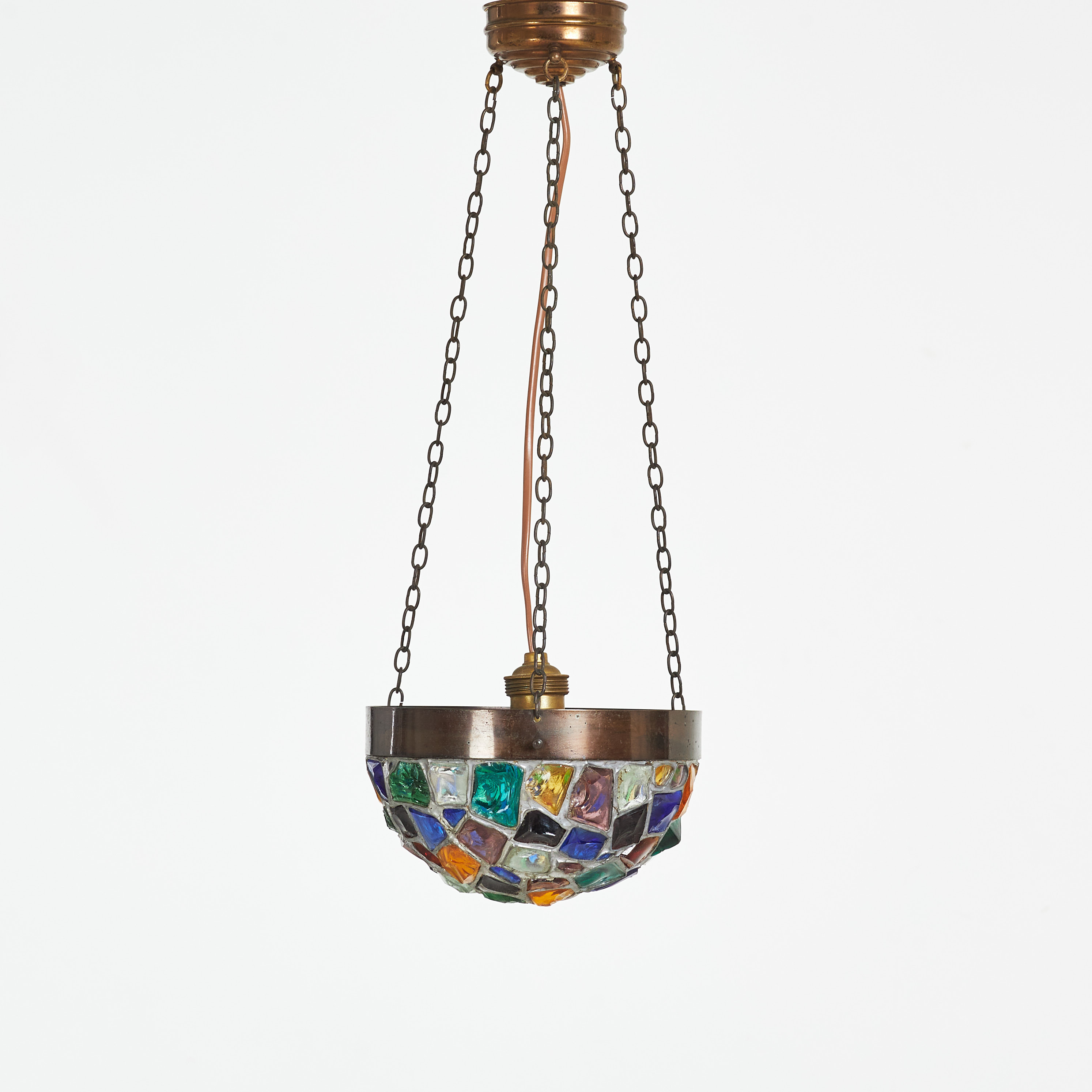TAKAMPEL, stomme i patinerad metall, kupan med blyinfattat polykromt råglas, 1900-tal.