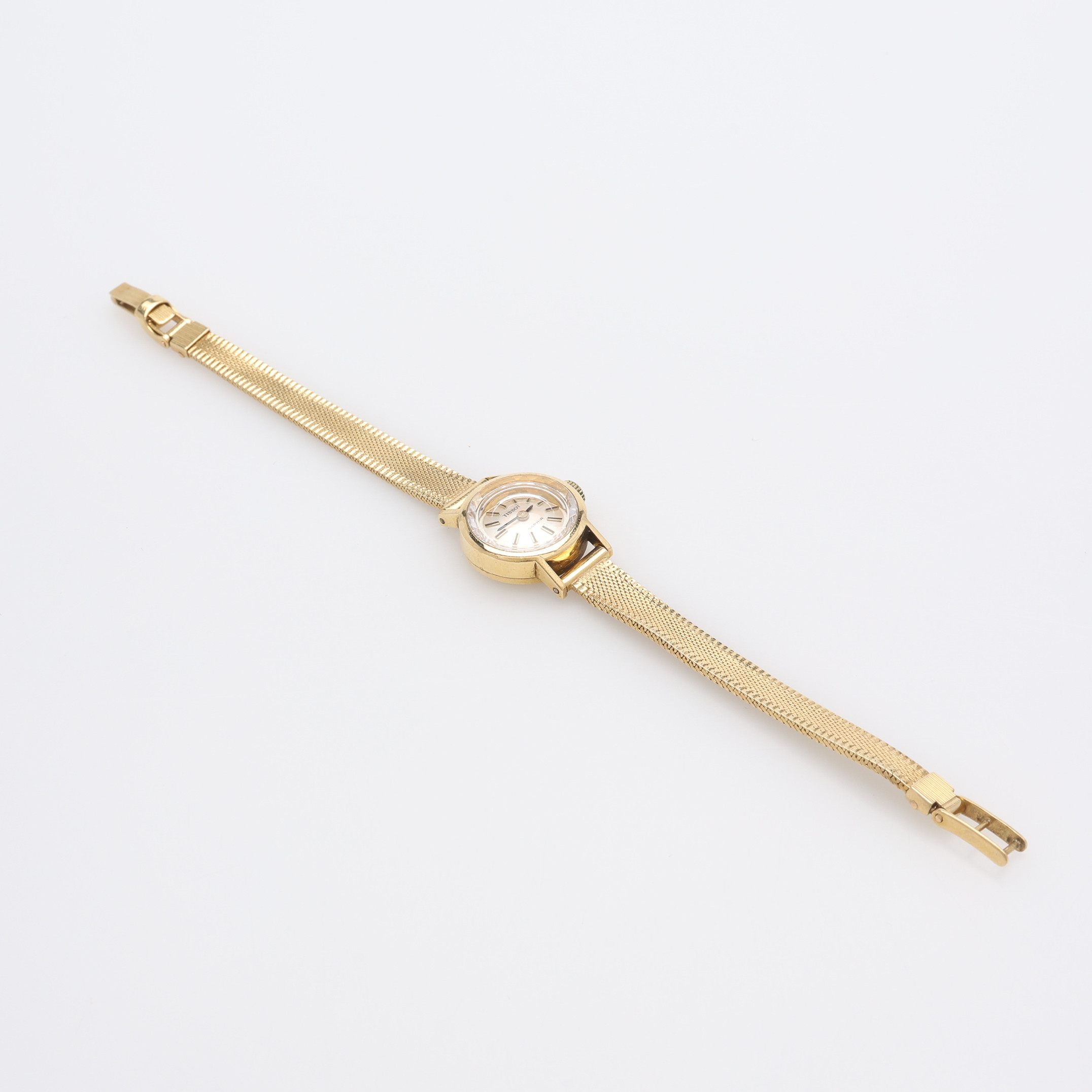DAMARMBANDSUR, 18K GULD I BOETT & LÄNK, TISSOT, MANUELLT UPPDRAG, TOTALT CIRKA 21,2 GRAM.